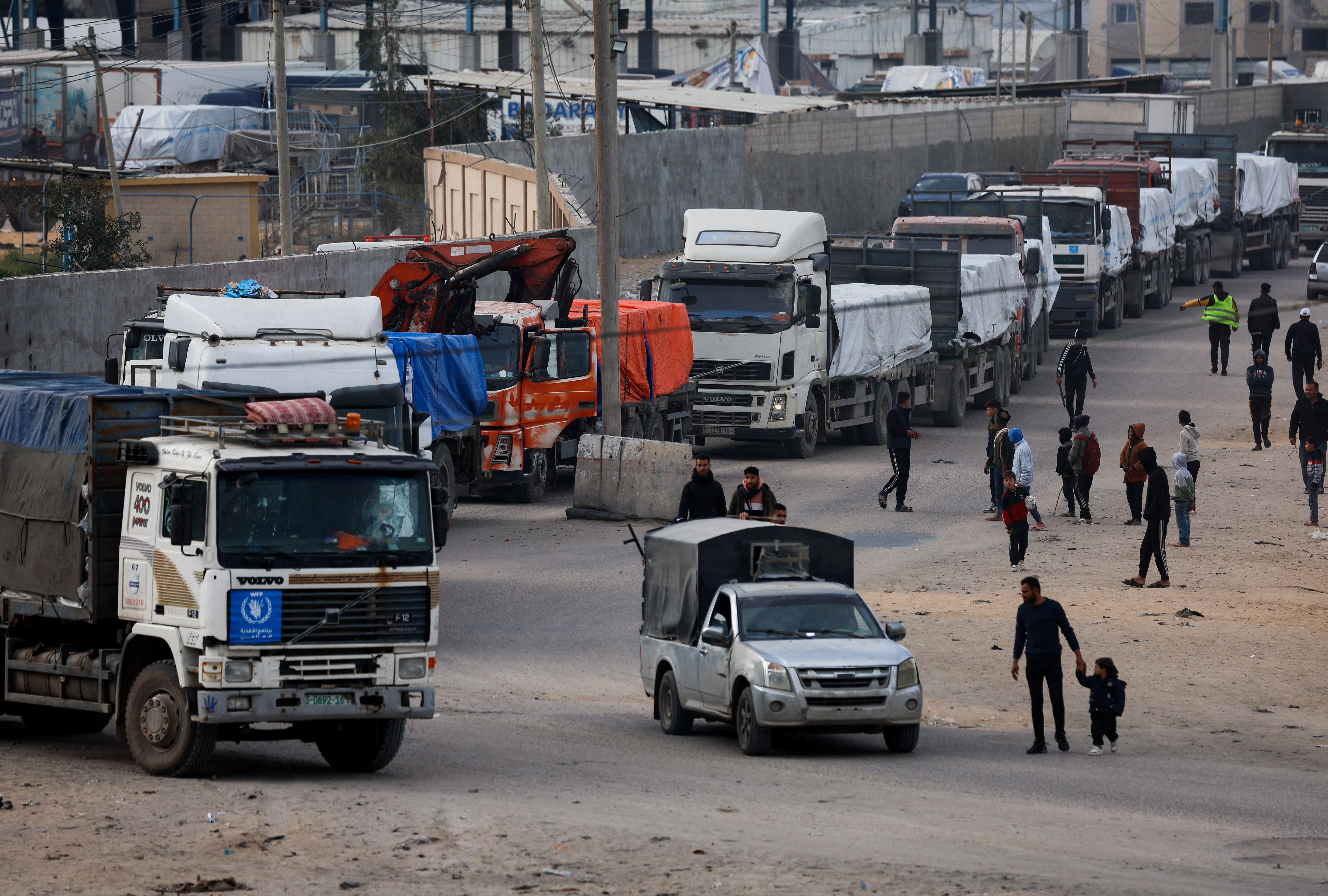 Trucks carrying aid arrive, amid the ongoing conflict between Israel and the Palestinian Islamist group Hamas, in Rafah in the southern Gaza Strip