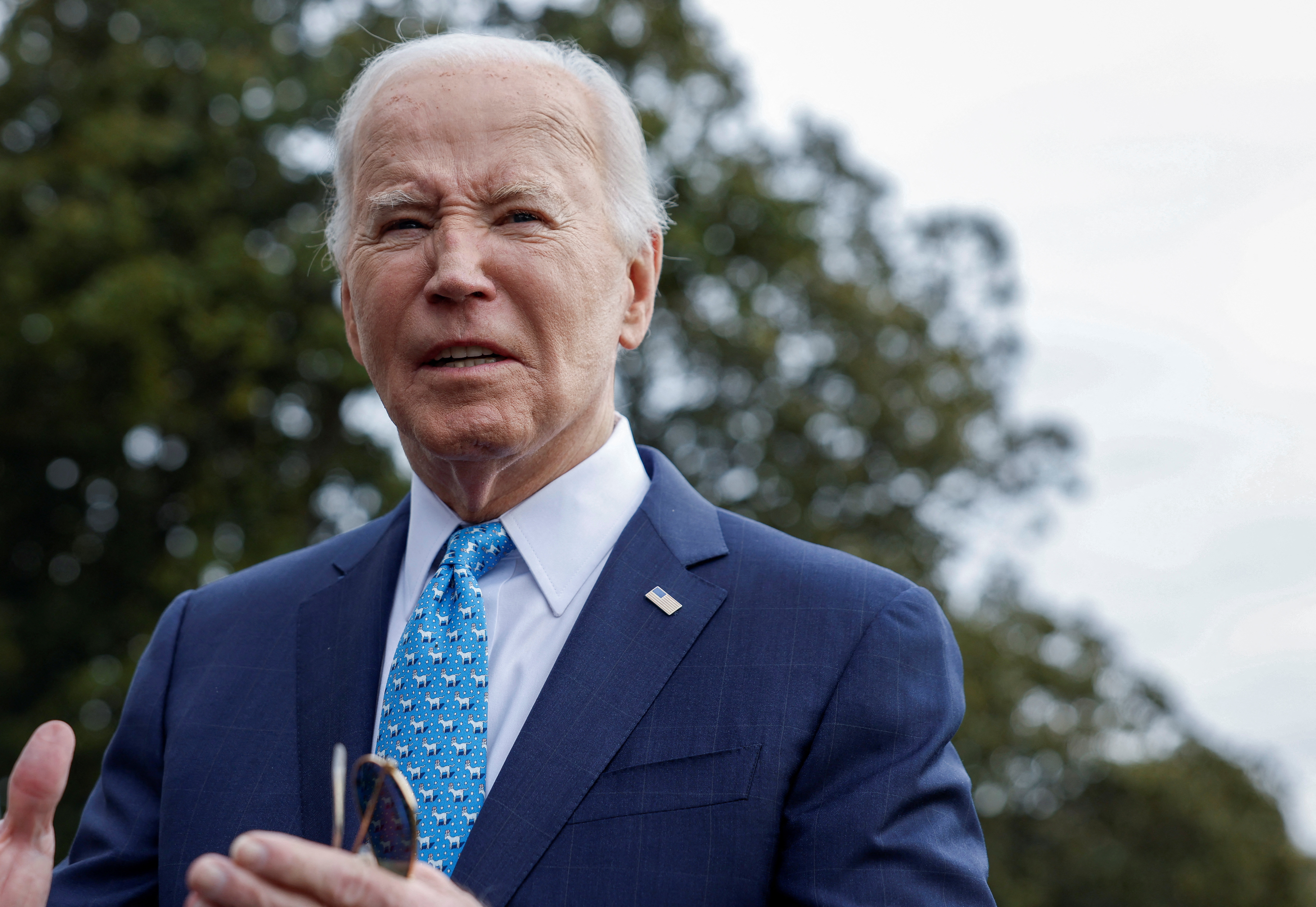 U.S. President Joe Biden looks on as he speaks to the media, before deparing the White House for Florida, in Washington