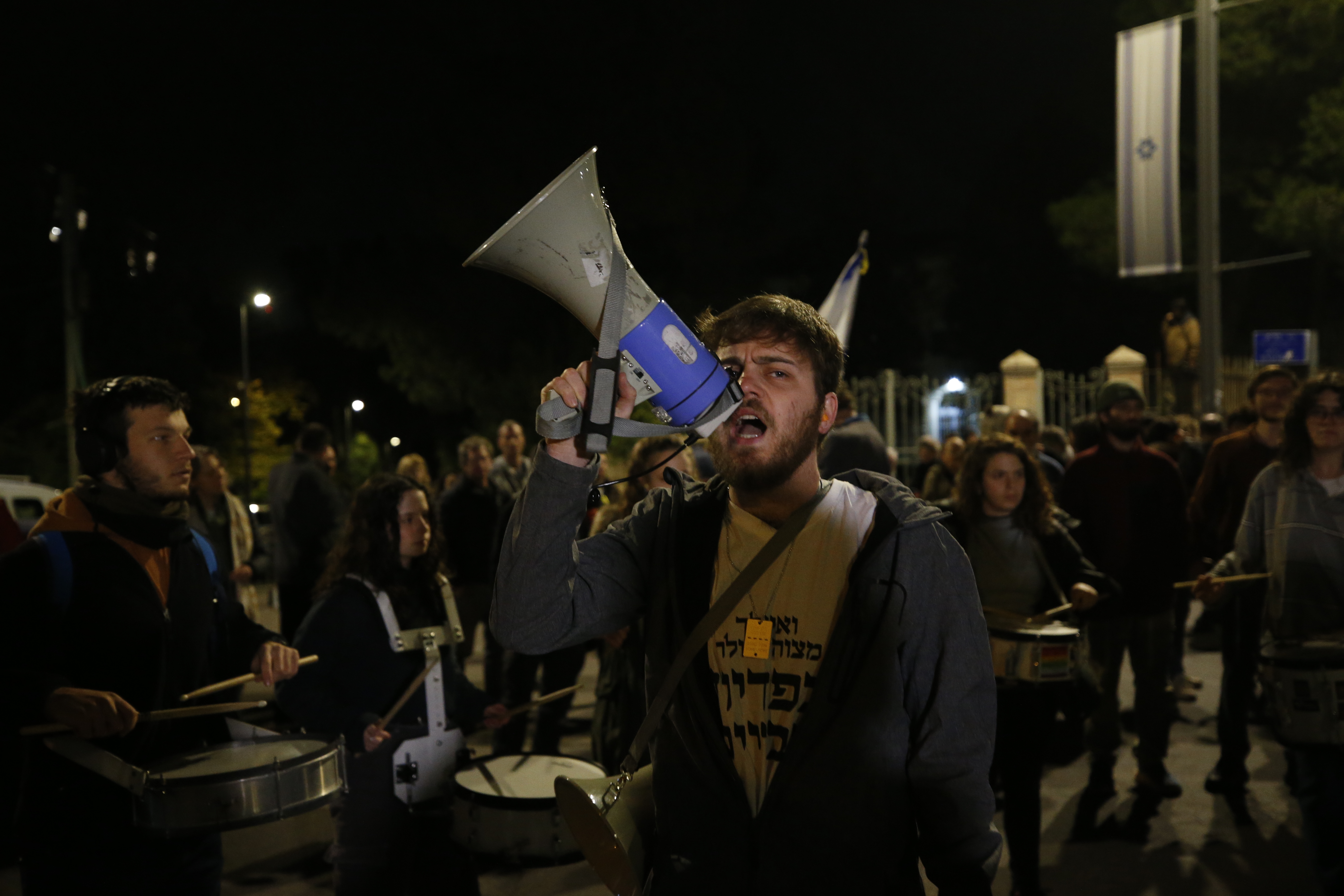 People gather in front of the house of Israeli President Isaac Herzog to demonstrate demanding the release of prisoners held by Hamas in Jerusalem on January 06