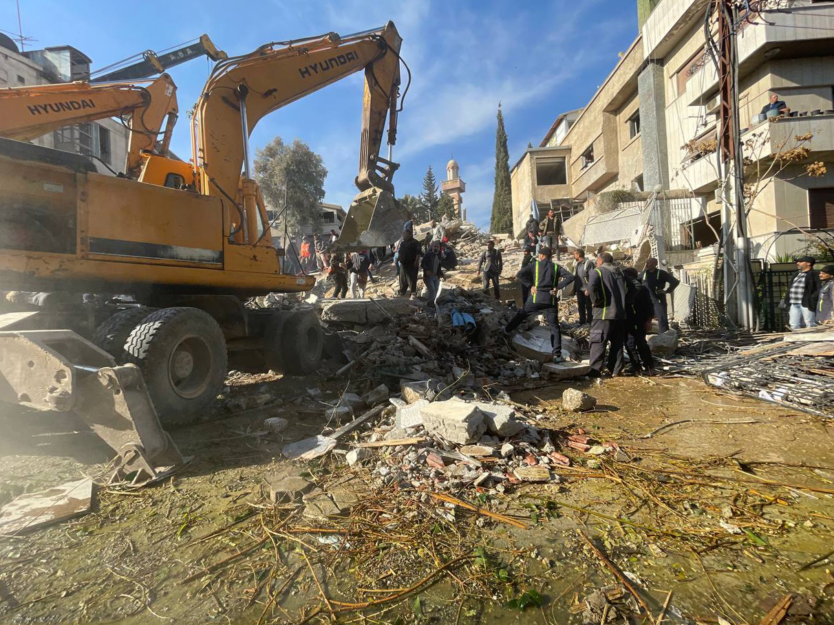 Heavy duty machine removes debris of a destroyed building after Israel's airstrike, which killed 4 commander of Islamic Revolutionary Guard Corps advisers, in Damascus, Syria on January 20