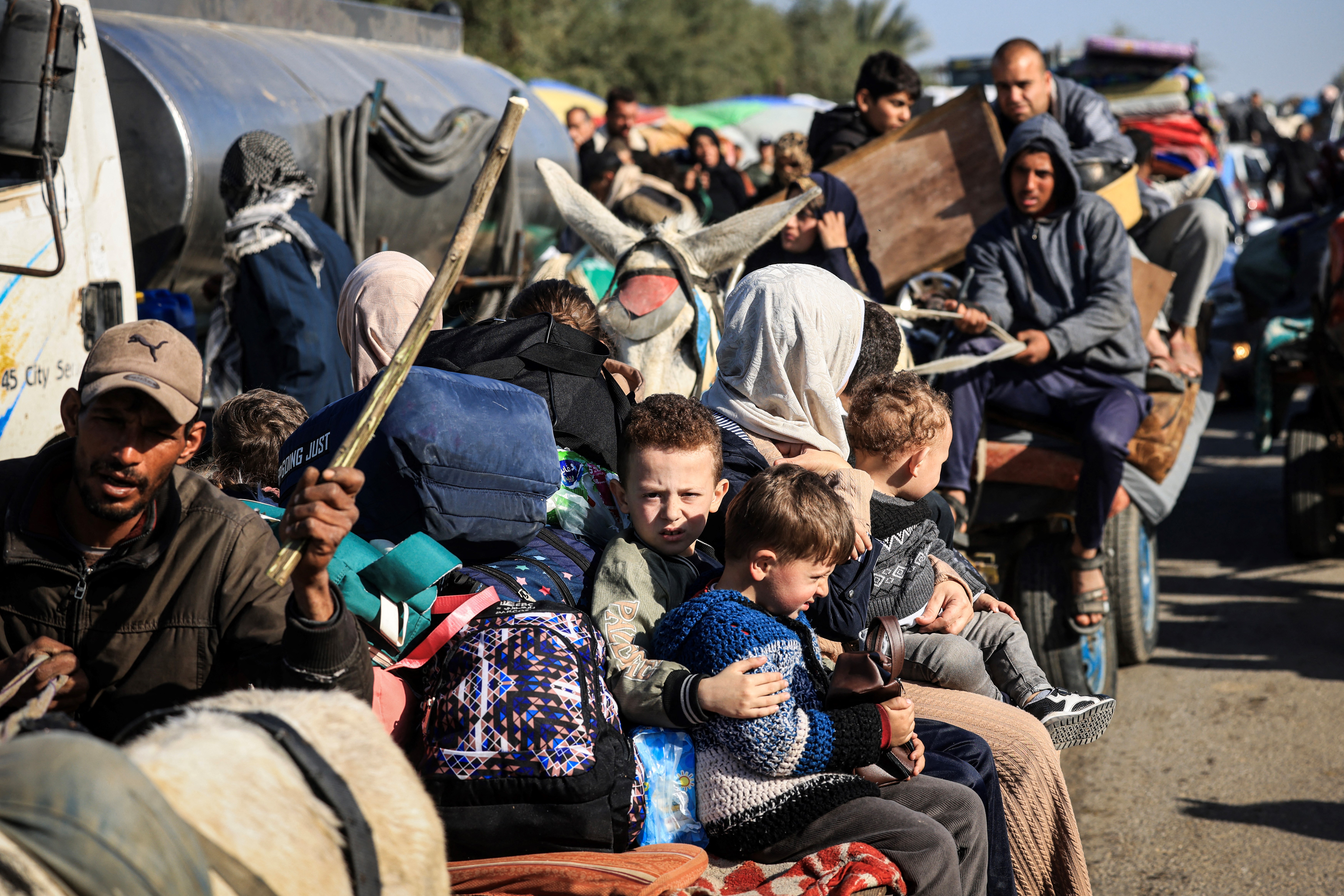 Palestinian families fleeing the city on the coastal road leading to Rafah