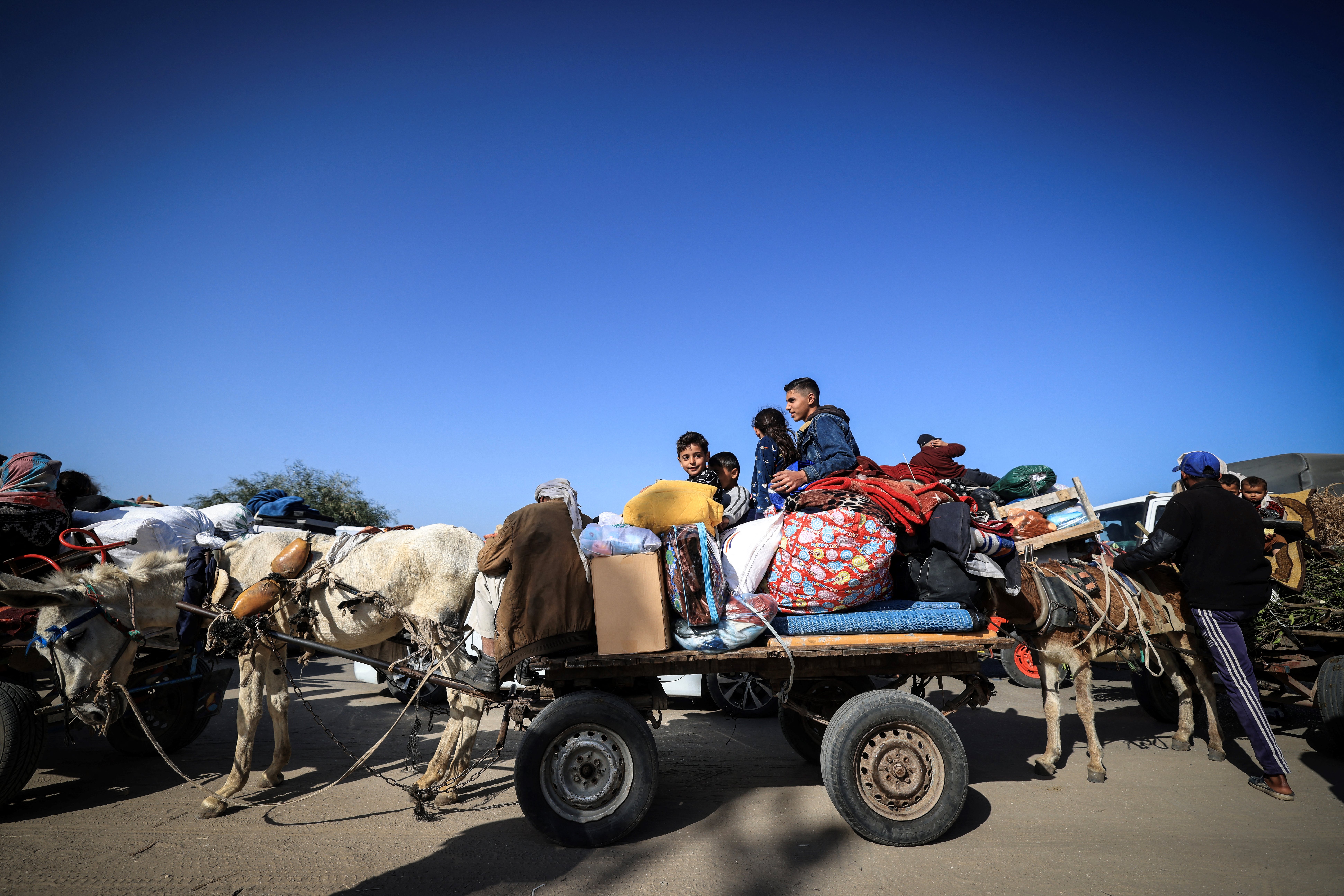 Palestinian families fleeing the city on the coastal road leading to Rafah