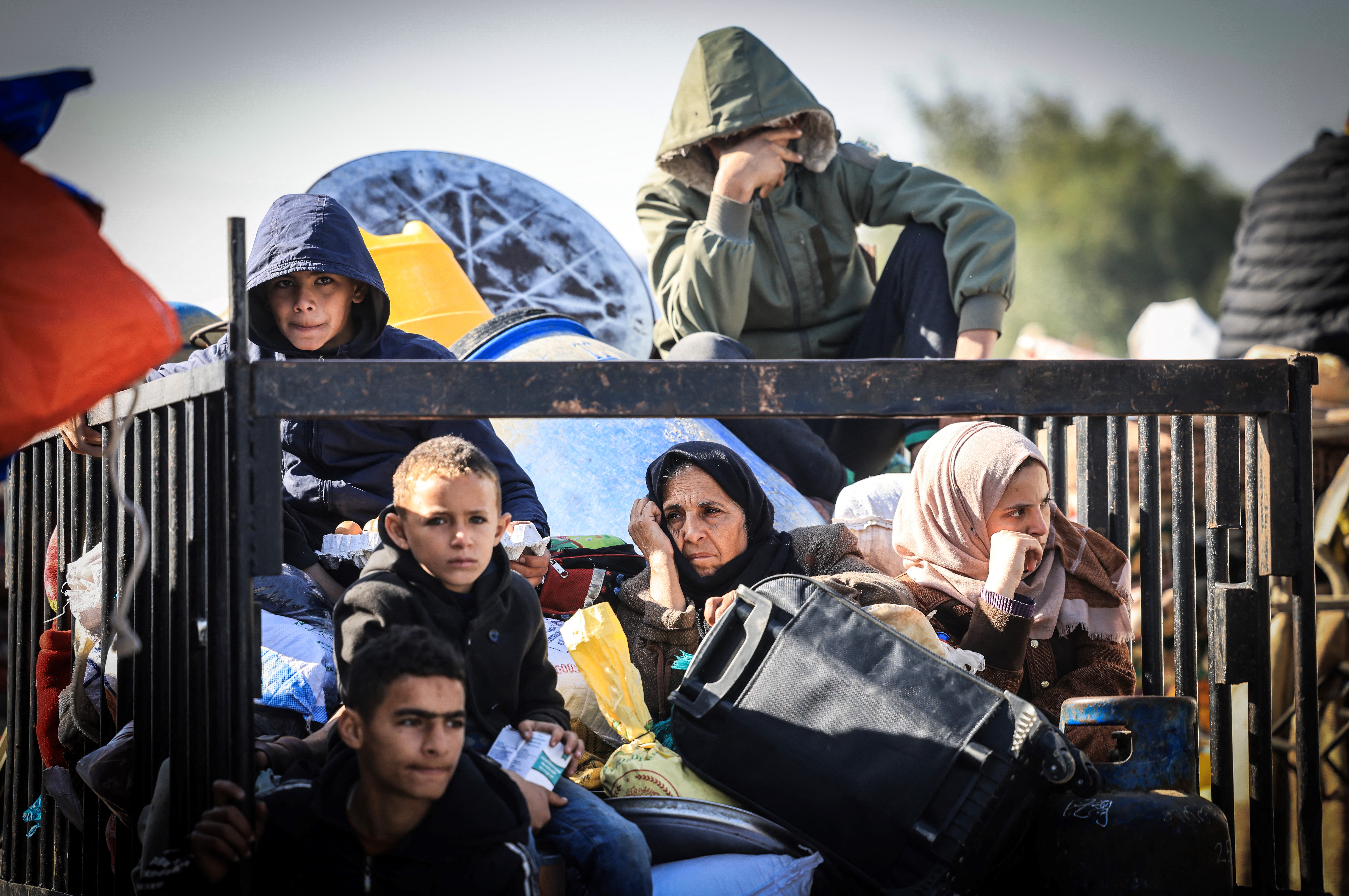 Palestinian families fleeing the city on the coastal road leading to Rafah