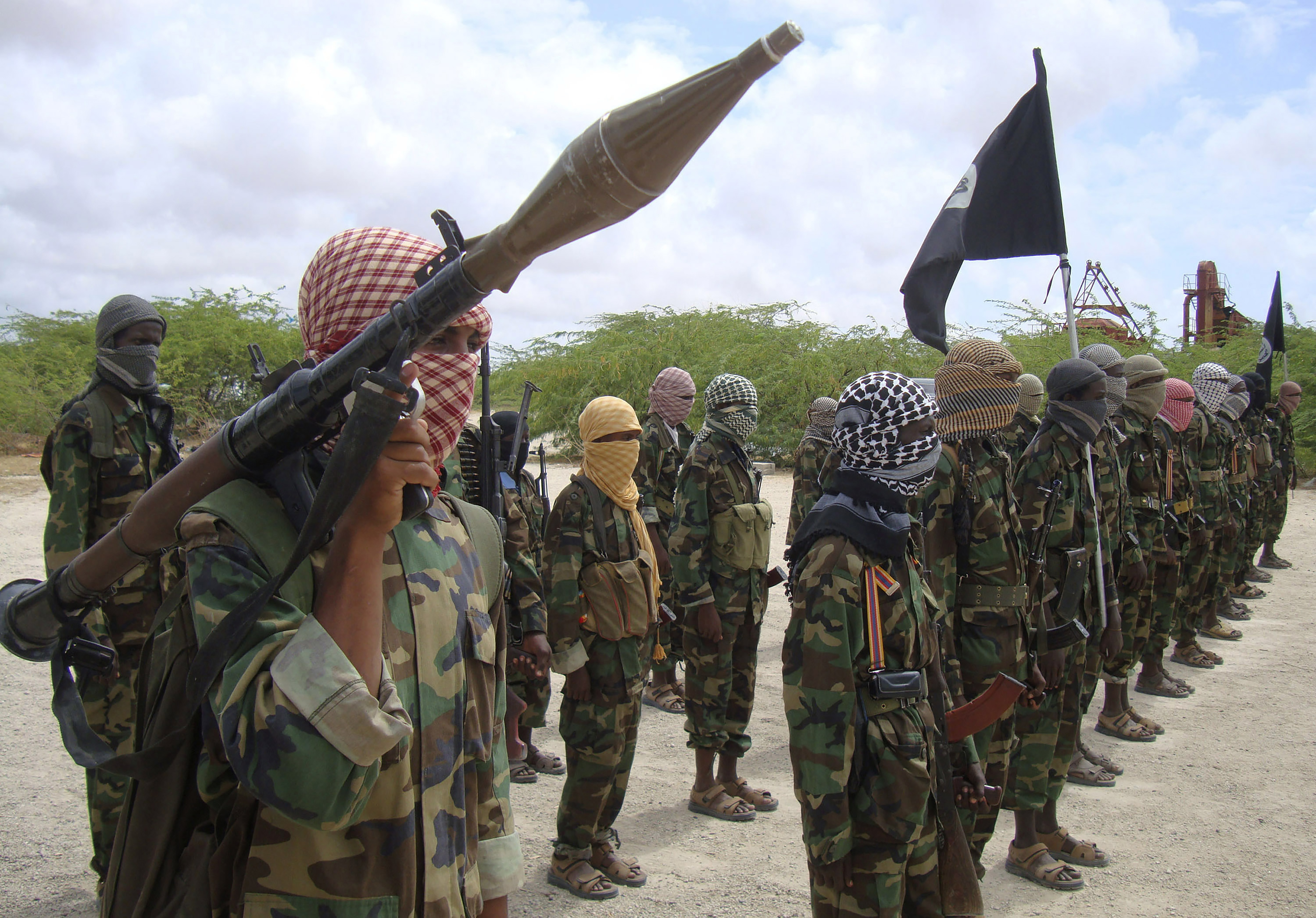 Al-Shabaab fighters display weapons as they conduct military exercises in northern Mogadishu, Somalia