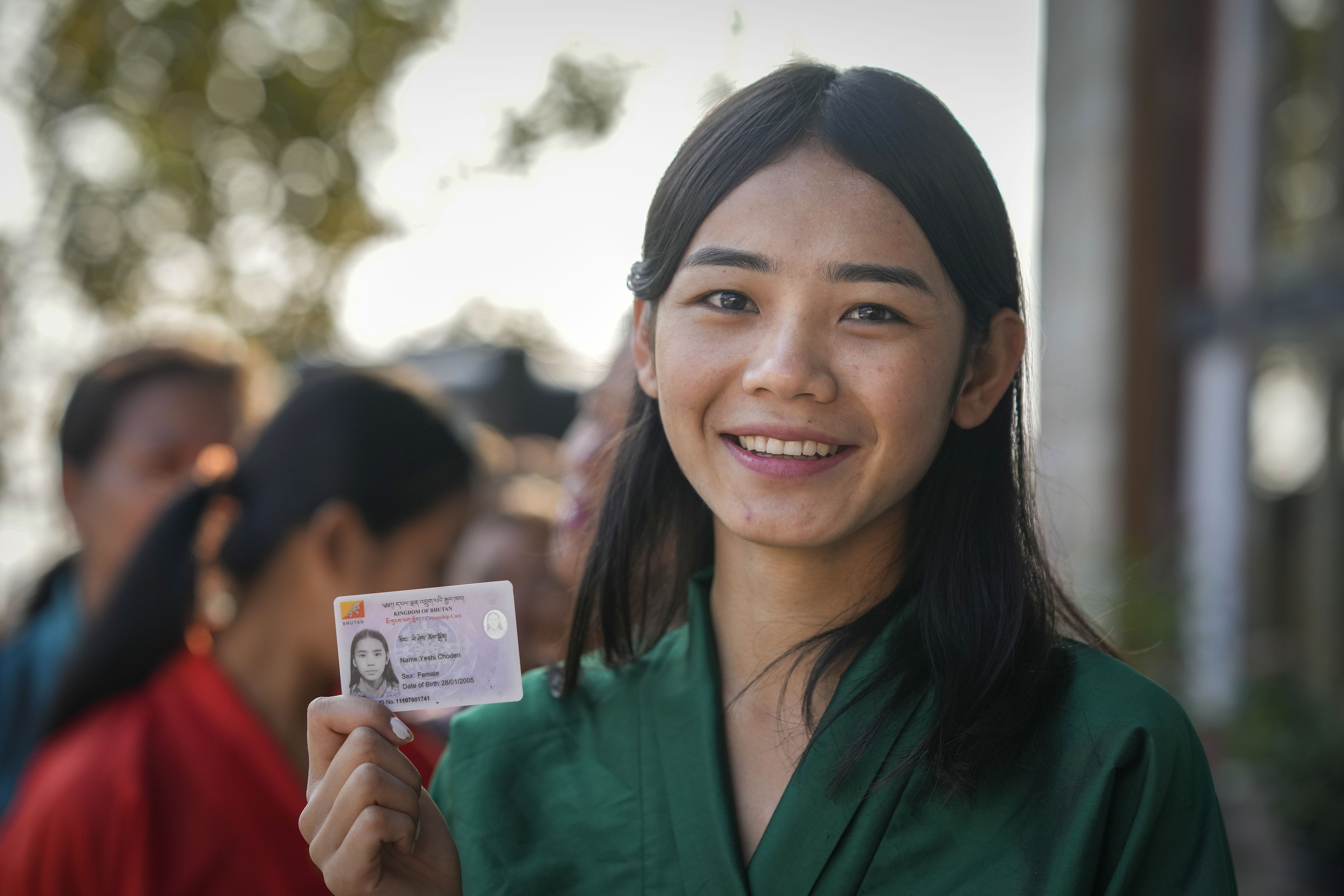 First time voter Yeshi Choden poses for camera as she waits to cast her vote in the national elections in Deothang, Bhutan