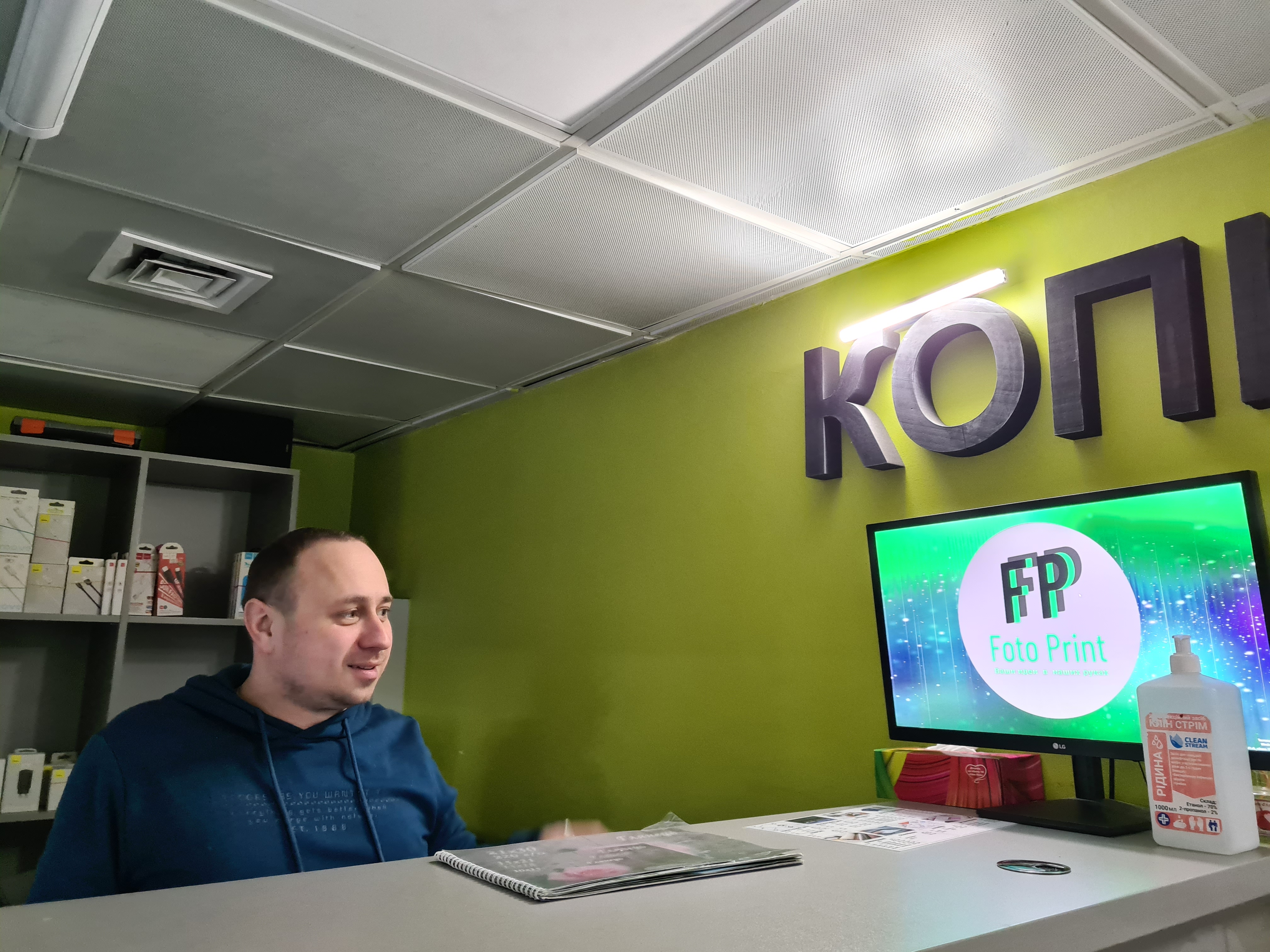 Artem Honcharuk shows how battery-powered lamps used to light his print shop in Kyiv during blackouts-1705572911