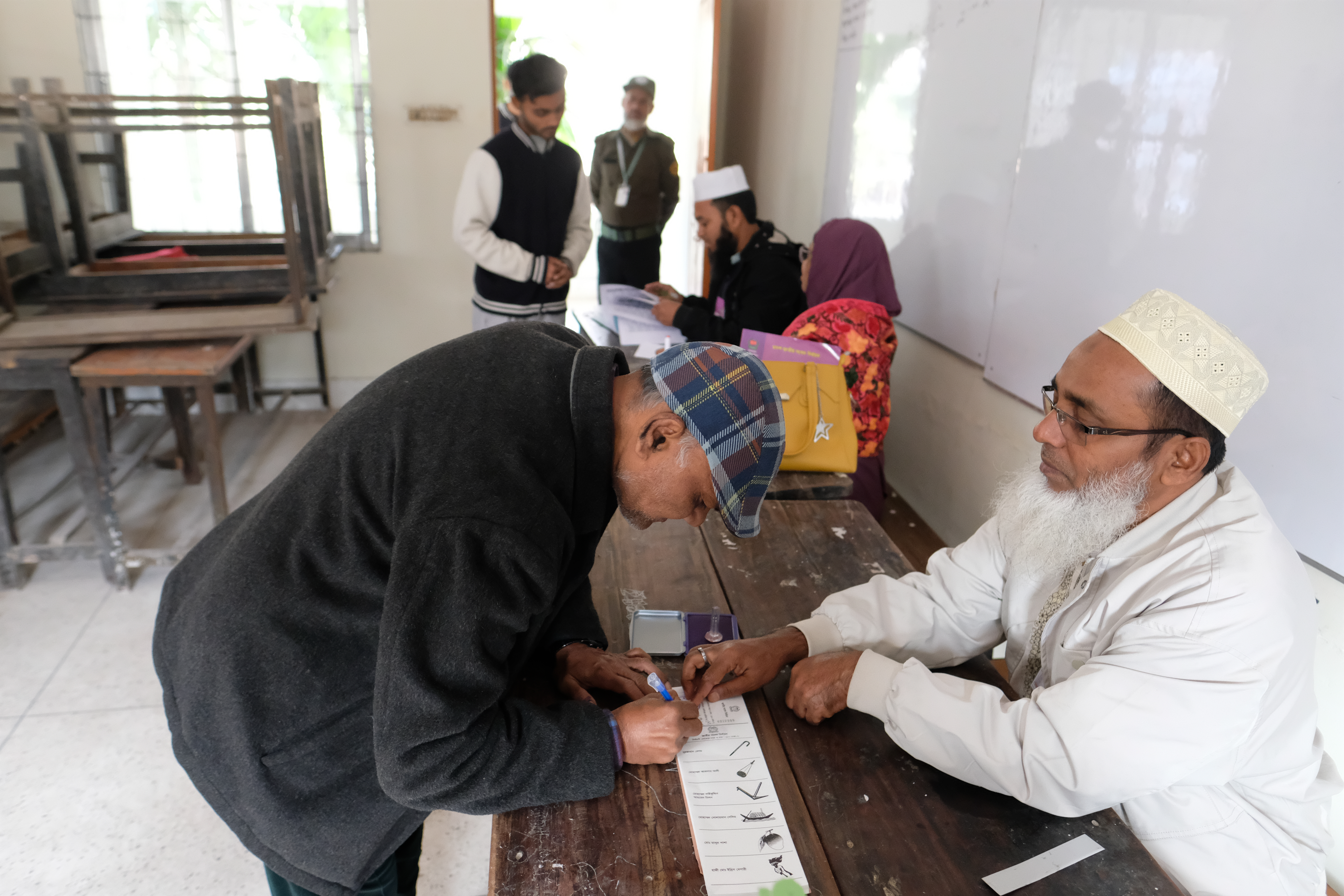 Bangladeshi people casting their votes at a polling station in Old Dhaka, Bangladesh.