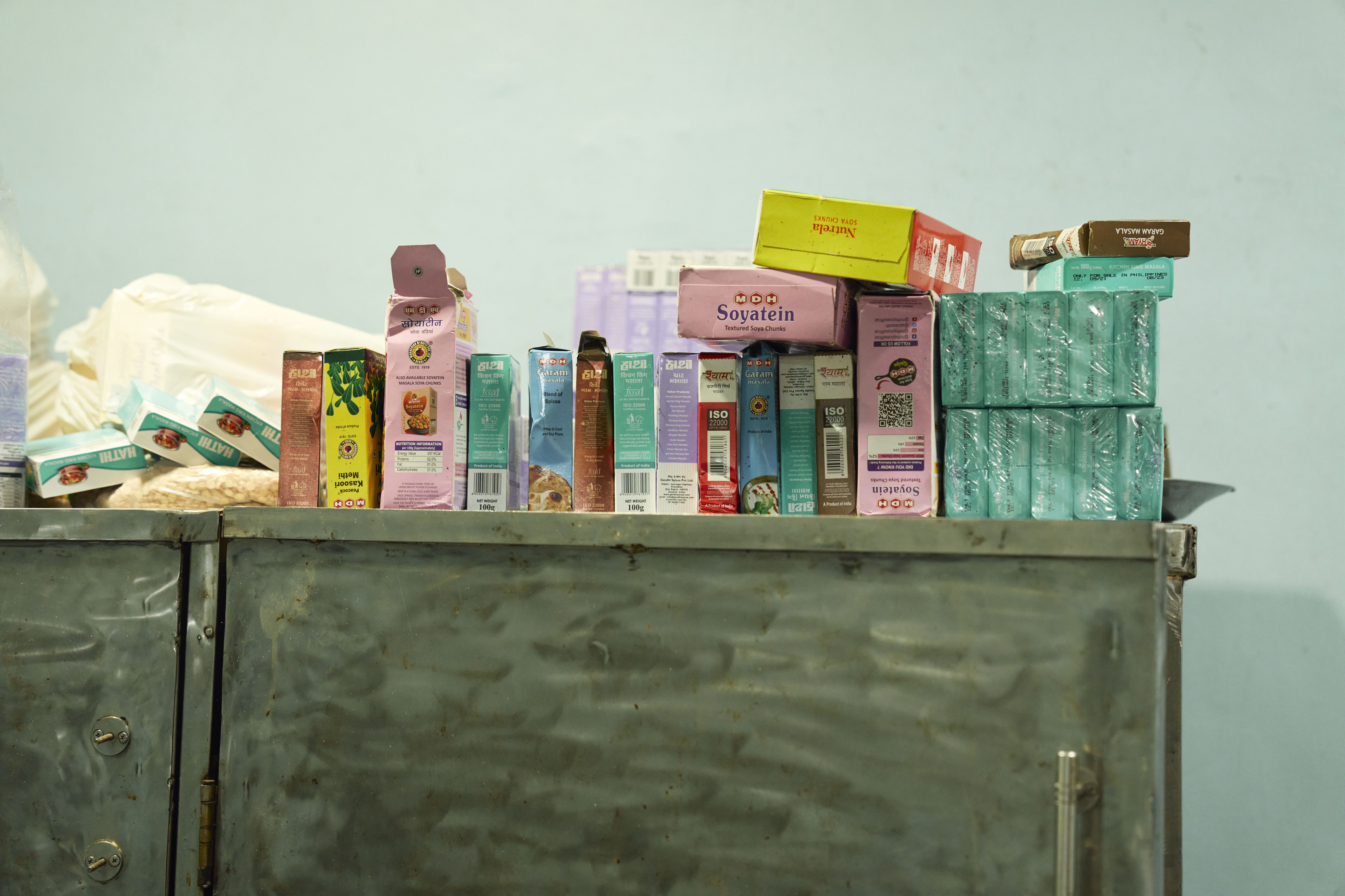 A variety of spices in the pantry of the Khalsa Diwan Sikh Temple Manila Fried pakodas from the Khalsa Diwan Sikh Temple kitchen in Manila, Philippines A large pot of saag simmers as a volunteer uses a large drill to stir the dish thoroughly [Sonny Thakur/Al Jazeera]
