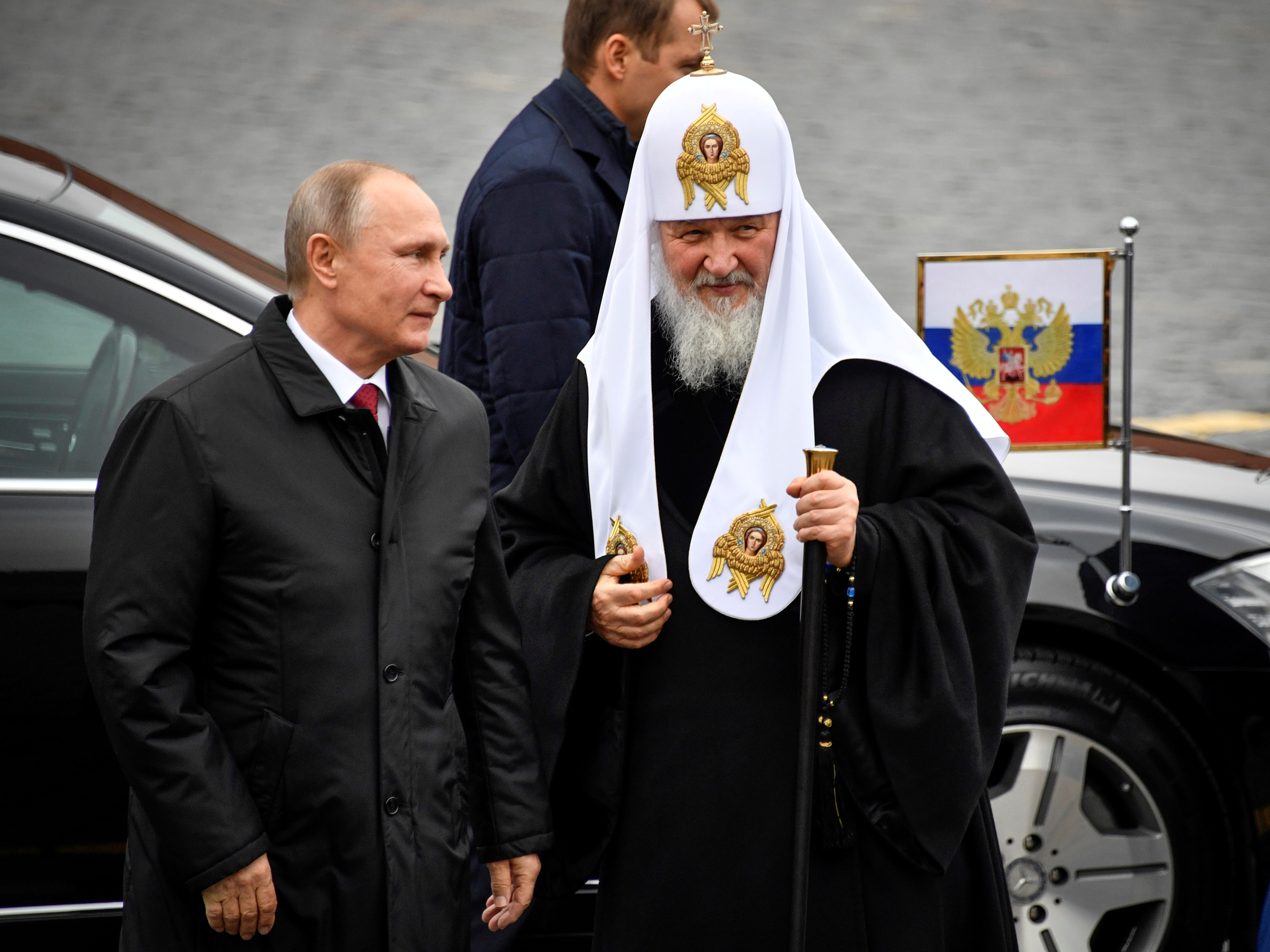 Russian President Vladimir Putin (L) and Patriarch of Russia Kirill arrive to lay flowers at the monument of Minin and Pozharsky on the Red Square near the Kremlin, marking the National Unity Day in Moscow Russia November 4, 2017. REUTERS/Alexander Nemenov/Pool