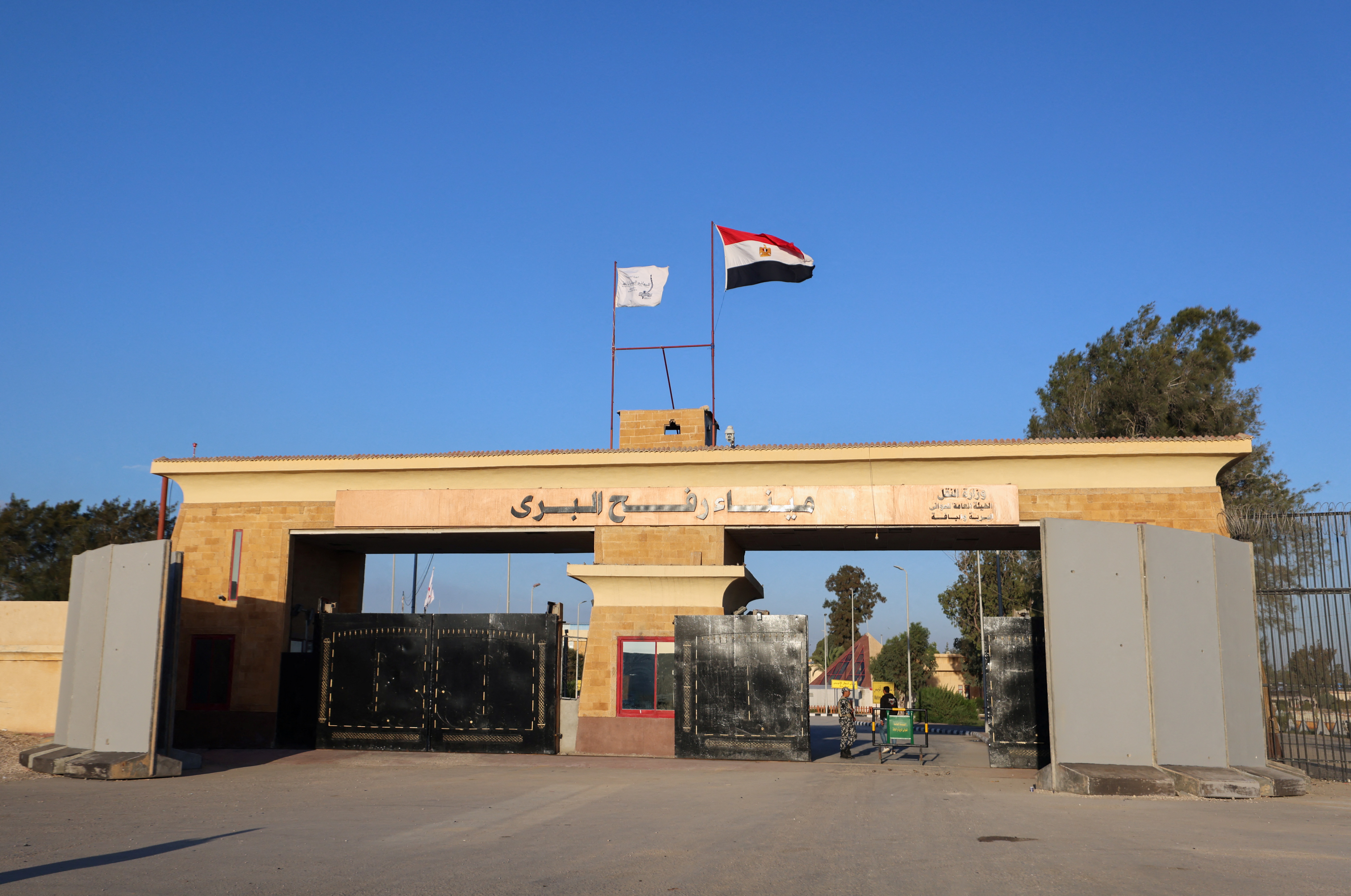 A member of the military stands guard at the Rafah border crossing between Egypt and the Gaza Strip, during a temporary truce between Hamas and Israel, in Rafah, Egypt, November 30, 2023