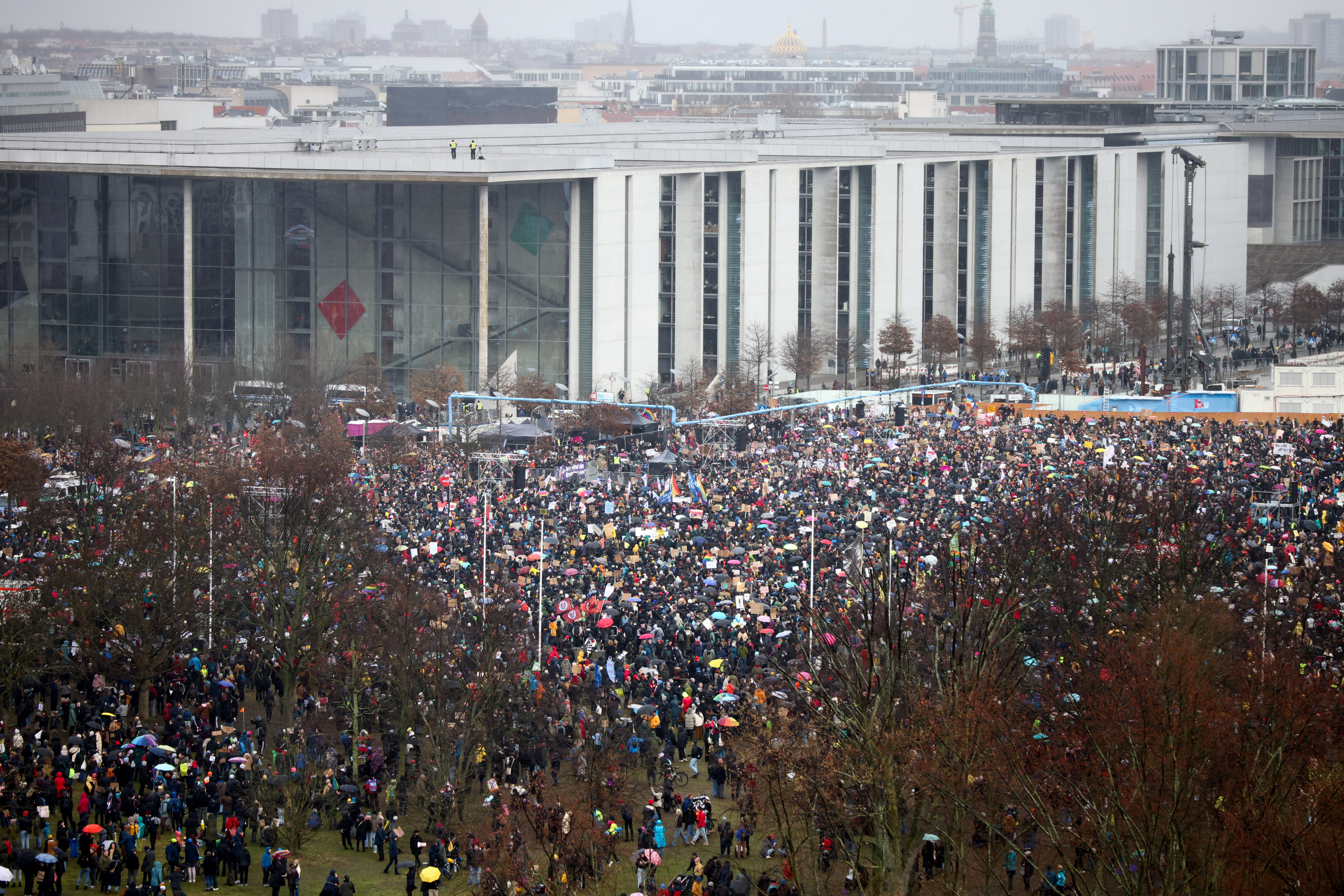 People gather during a rally of the broad alliance "Hand in Hand" under the slogan "Wir sind die Brandmauer" ("We are the Firewall") to protest against right-wing extremism and for the protection of democracy, in Berlin, Germany February 3