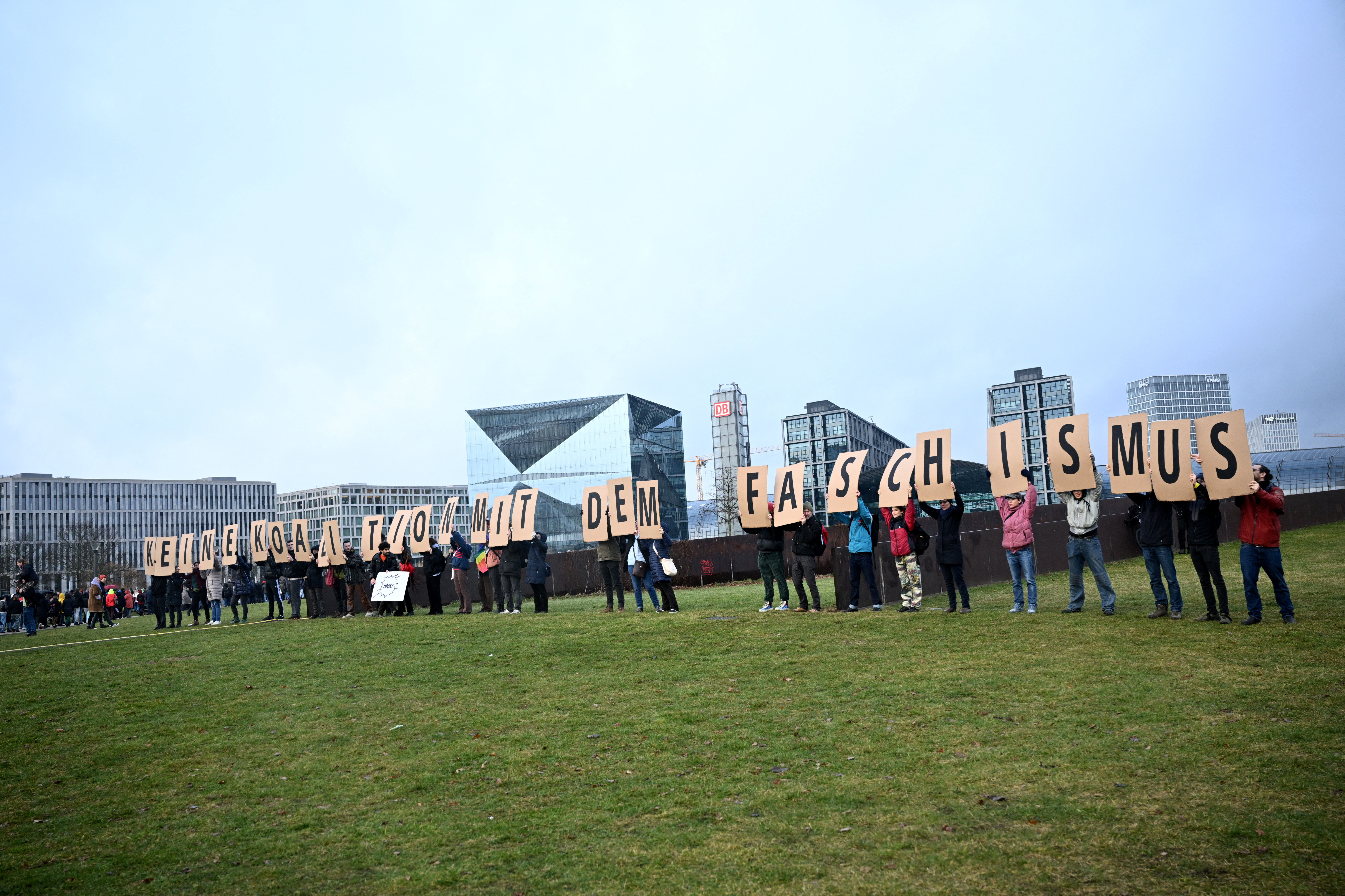 People gather during a rally of the broad alliance "Hand in Hand" under the slogan "Wir sind die Brandmauer" ("We are the Firewall") to protest against right-wing extremism and for the protection of democracy, in Berlin, Germany February 3