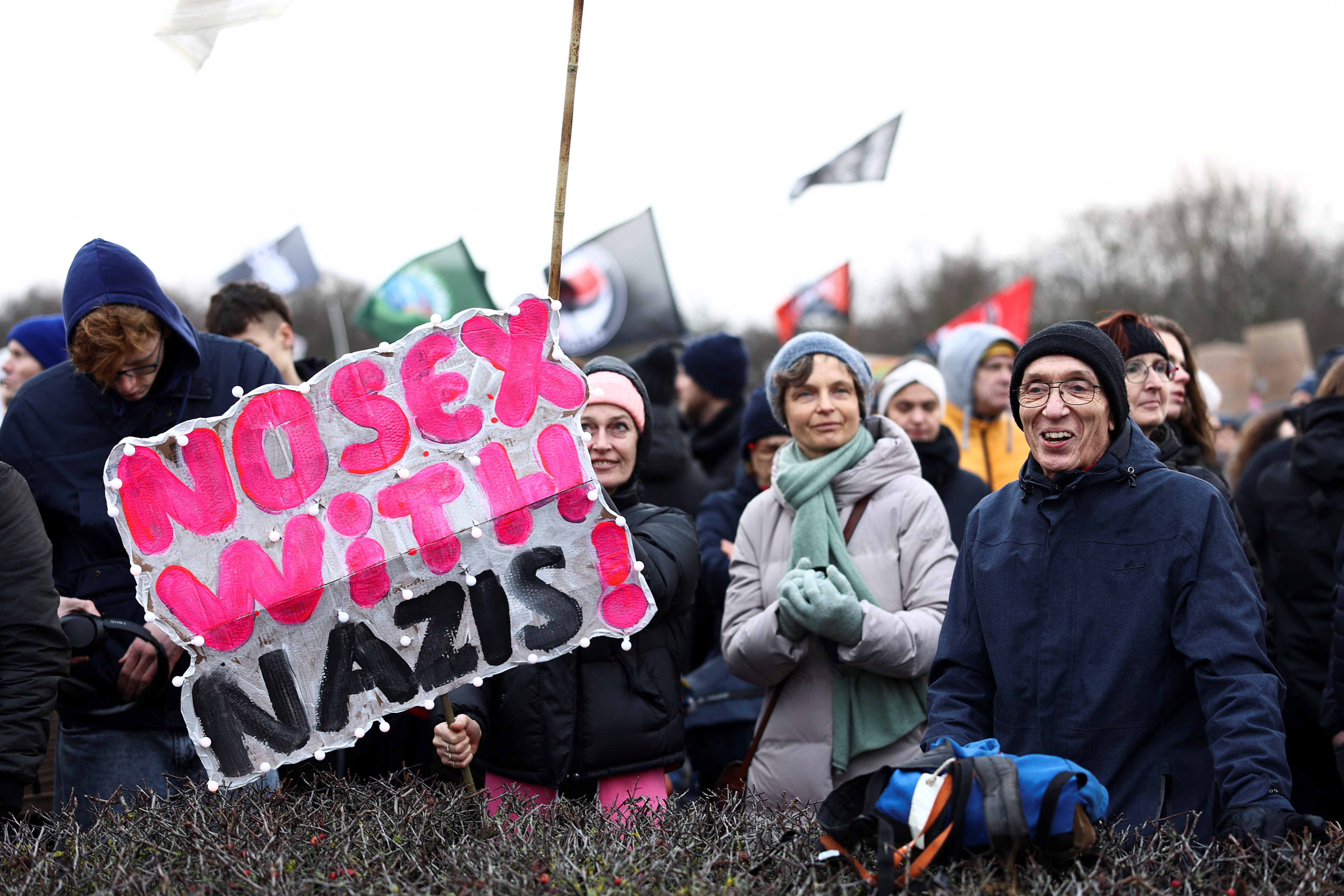 People attend a demonstration march to protest against right-wing extremism and for the protection of democracy in Berlin, Germany February 3,