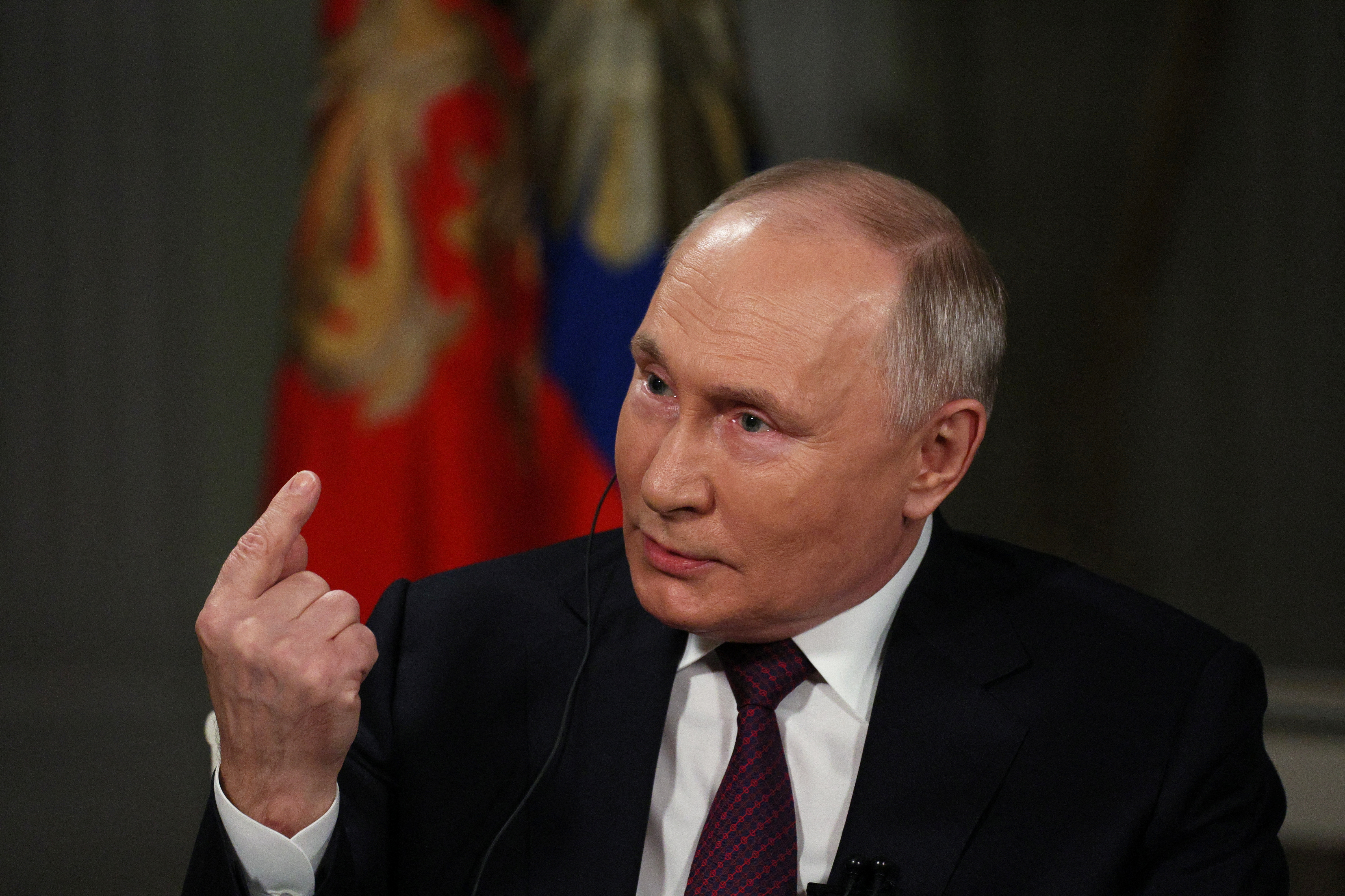 Russian President Vladimir Putin speaks during an interview with U.S. television host Tucker Carlson in Moscow