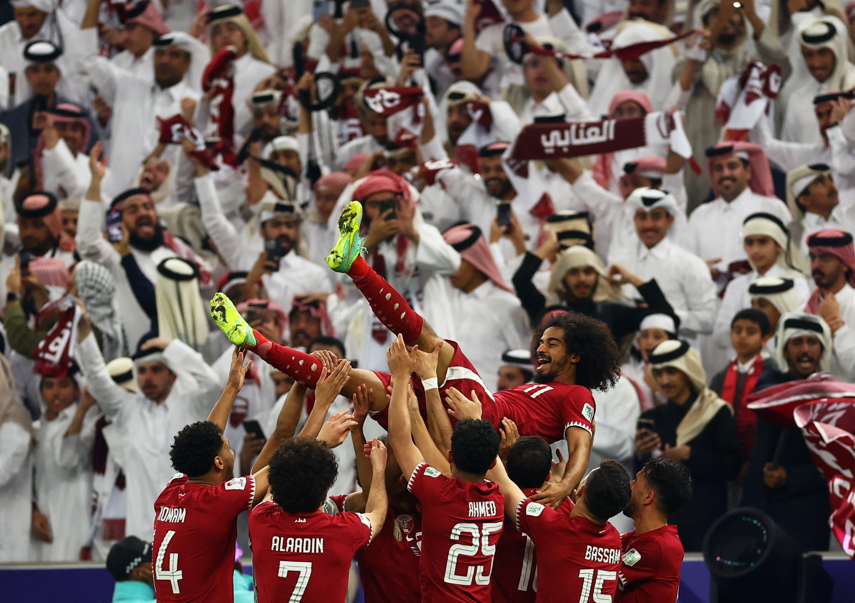 Qatar's Akram Afif celebrates with teammates