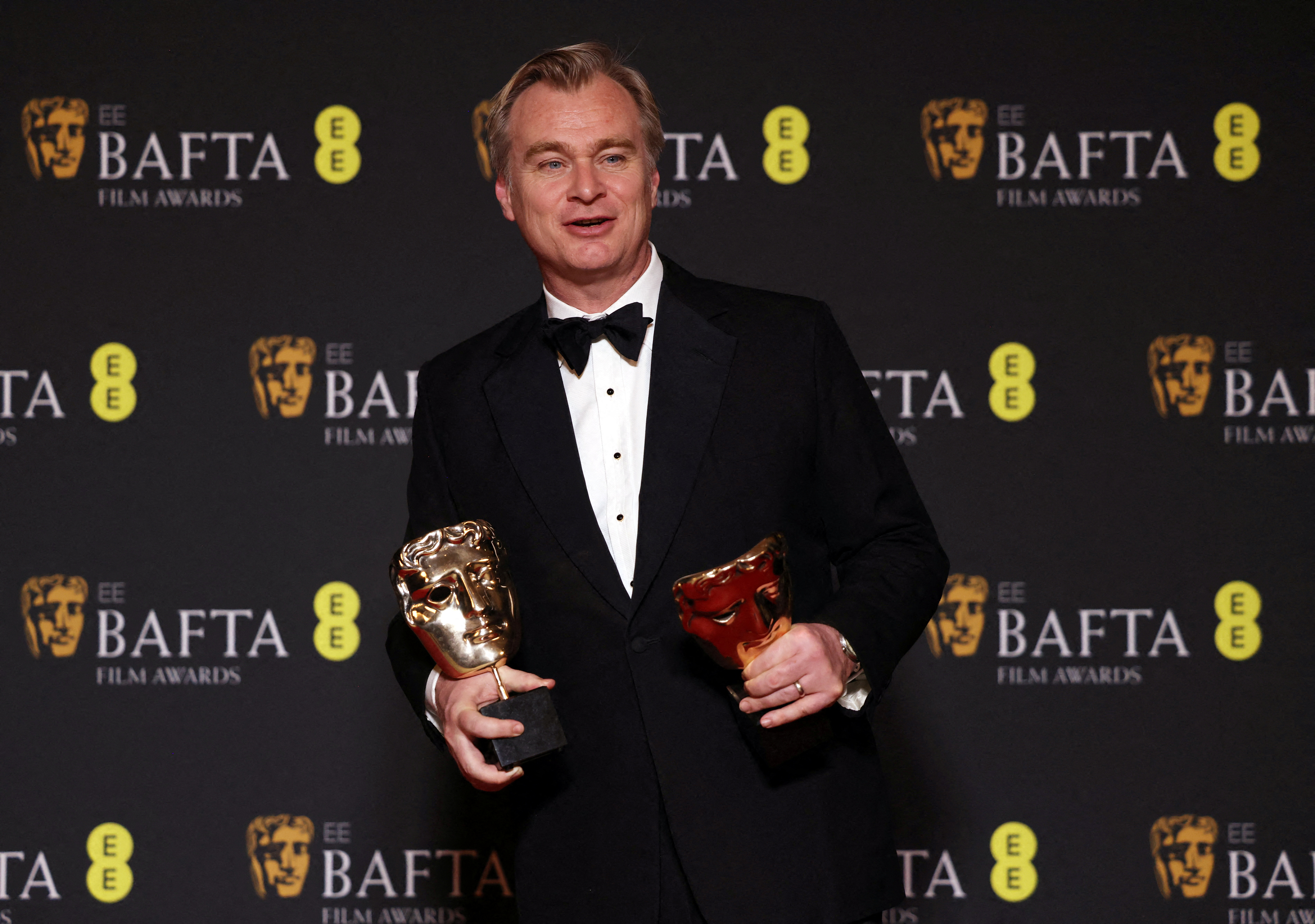 Christopher Nolan, winner of the awards for Director and Best Film for "Oppenheimer", poses in the winners' room during the 2024 British Academy of Film and Television Awards (BAFTA) at the Royal Festival Hall in the Southbank Centre, London.
