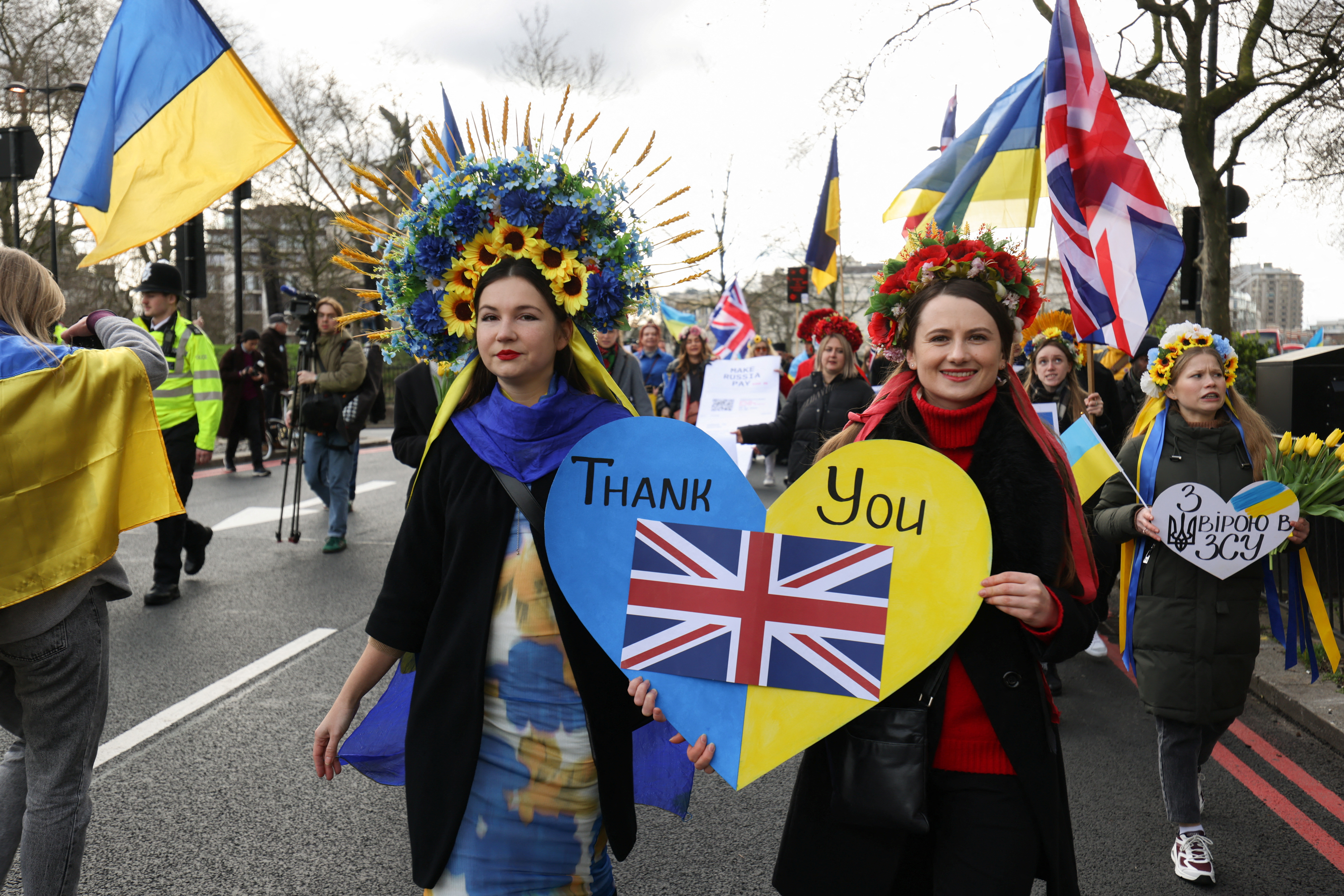 Women march during a demonstration on the two-year anniversary of Russia's invasion of Ukraine, in London, Britain, February 24