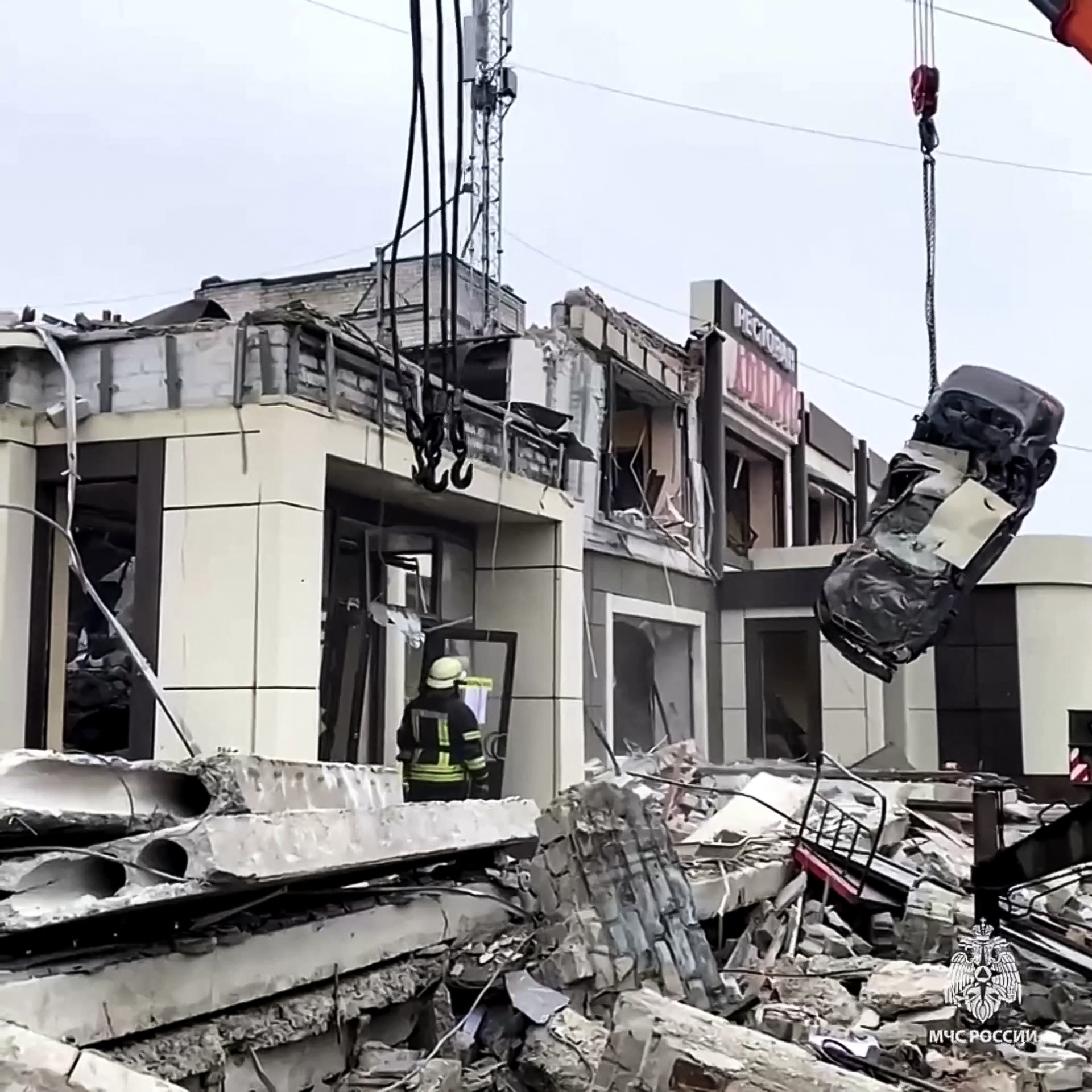 Rescuers clearing rubble of a destroyed bakehouse hit by recent shelling in the city of Lysychansk