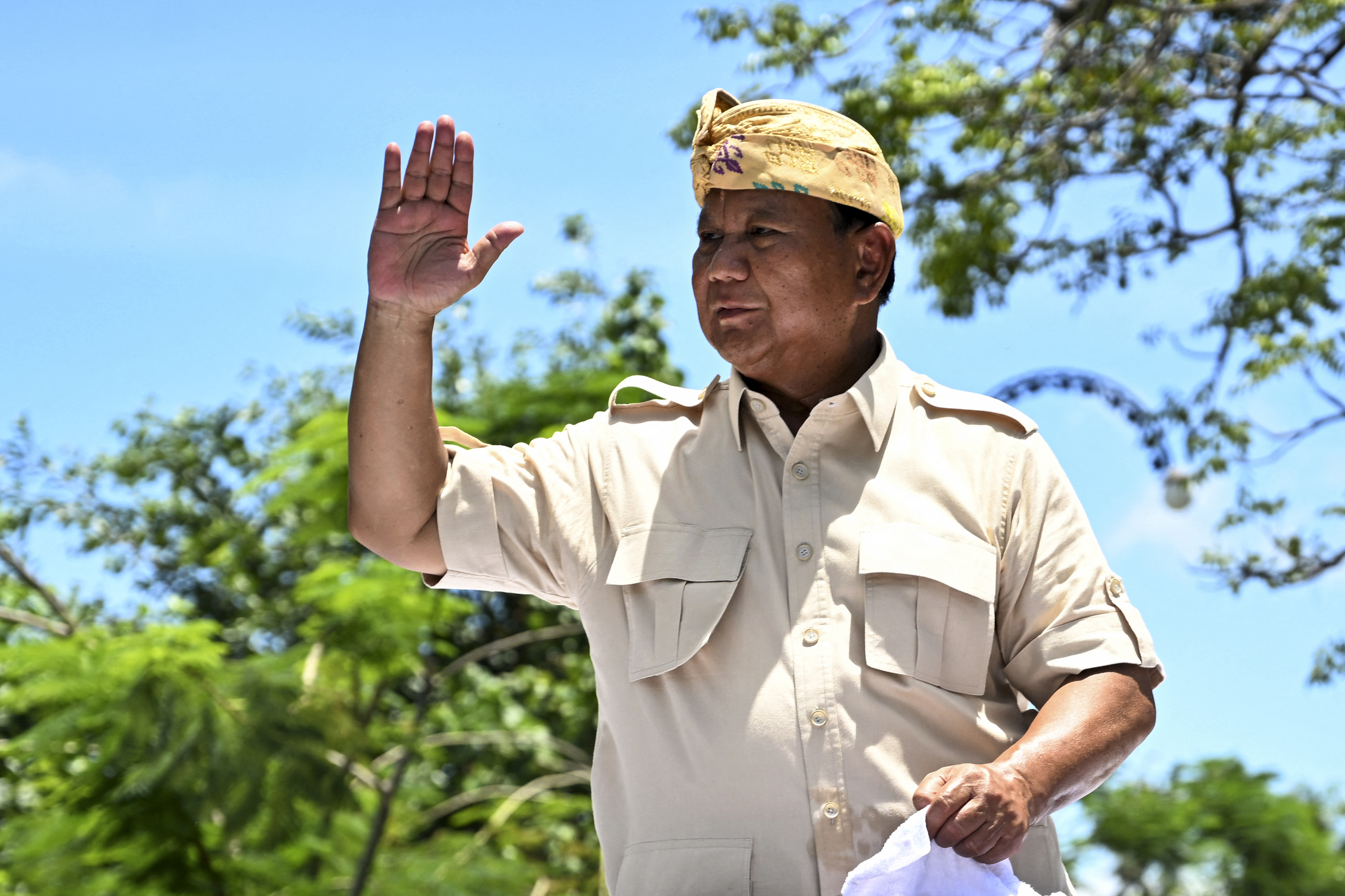 Prabowo Subianto greets supporters as he arrives at a rally in Bali.