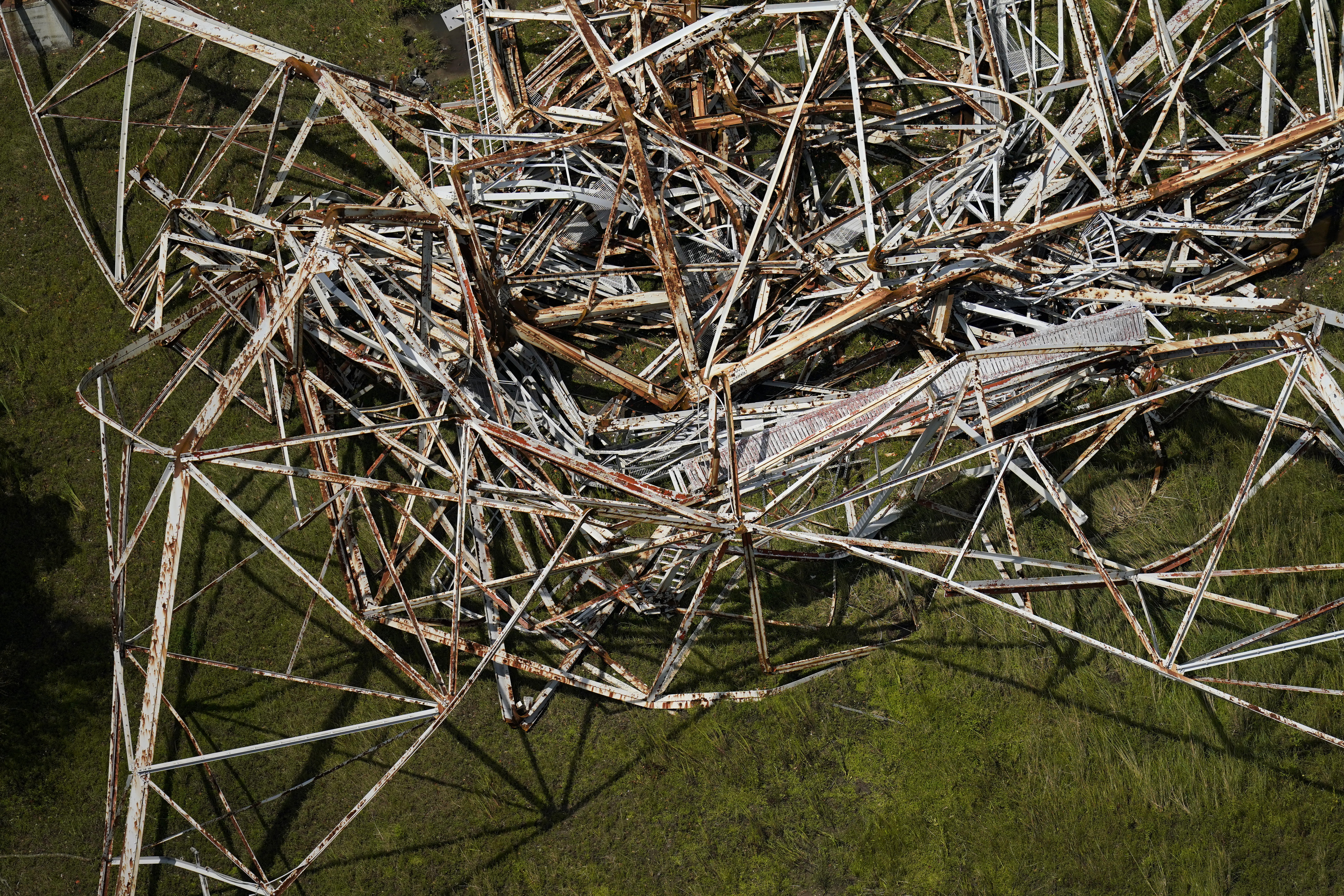 A twisted tower that carried crucial electrical feeder lines to the New Orleans metro area lies collapsed in the aftermath of Hurricane Ida in Bridge City, Louisiana