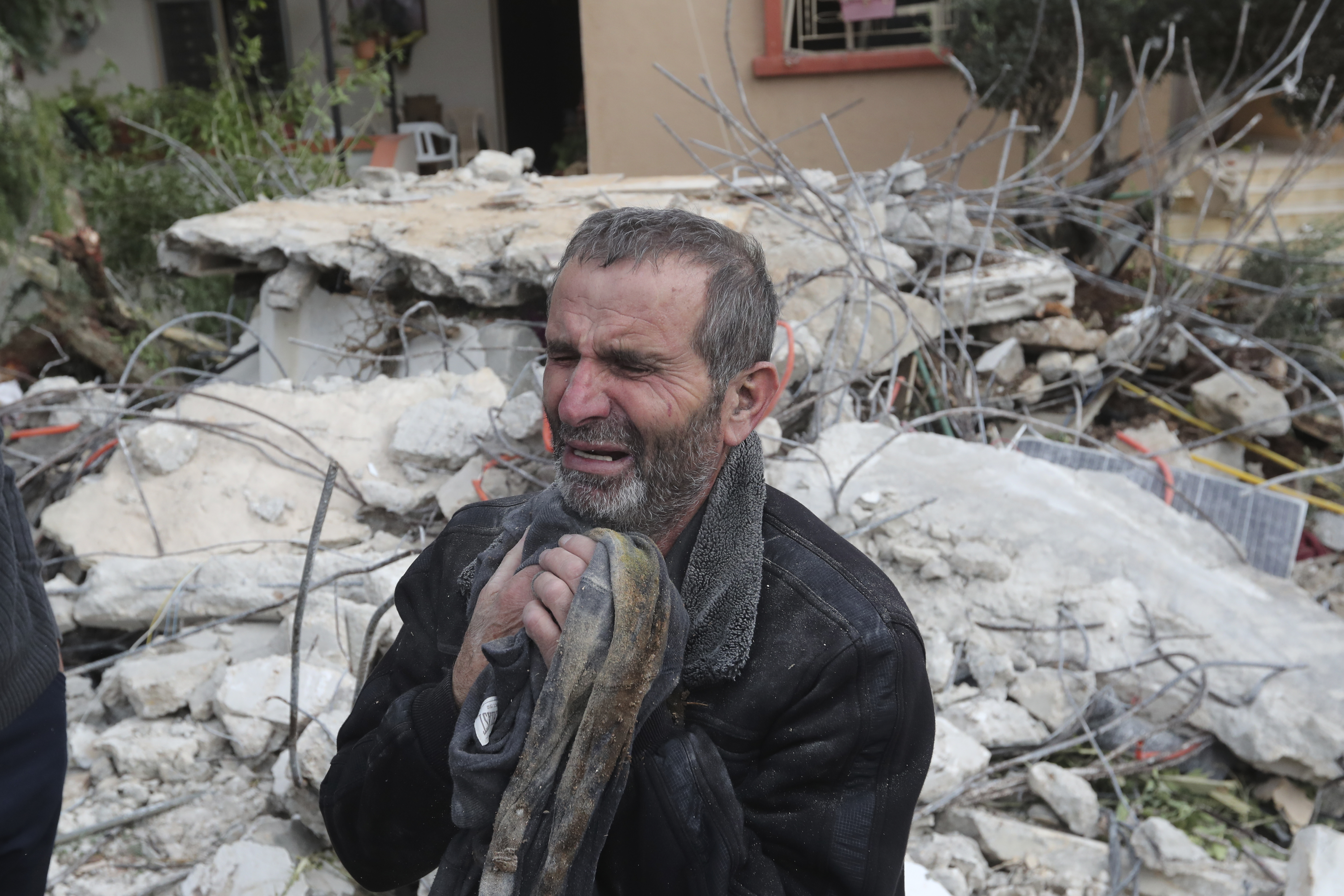 Ahmad Bazzi cries after two of his sons were killed