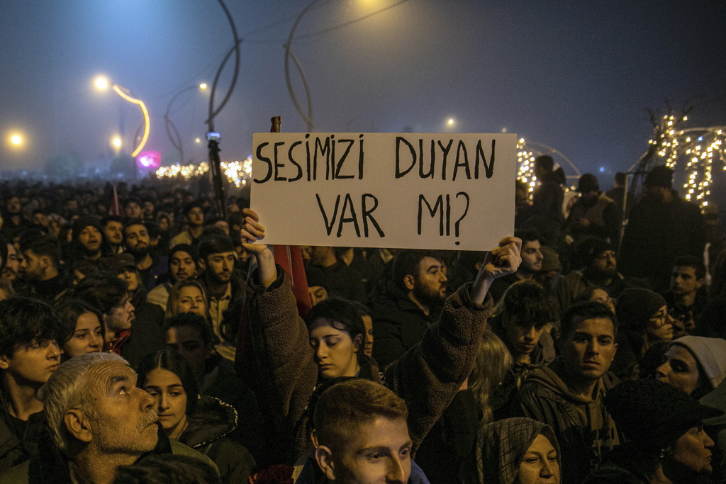 People gather to mark the one-year anniversary of the country's catastrophic earthquake, in the city of Antakya, Turkey