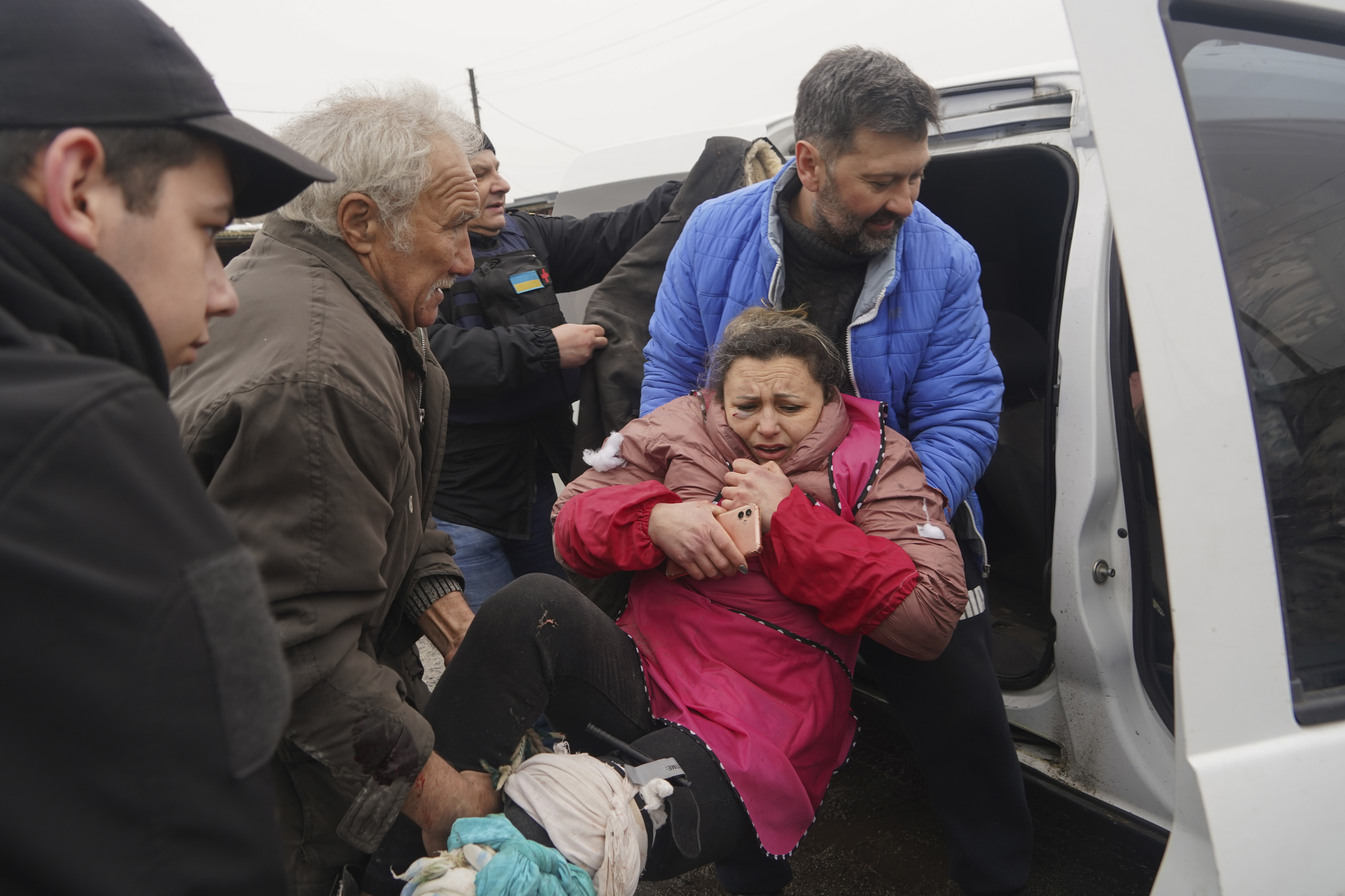 A woman being carried to an ambulance after a Russian attack on Kharkiv region