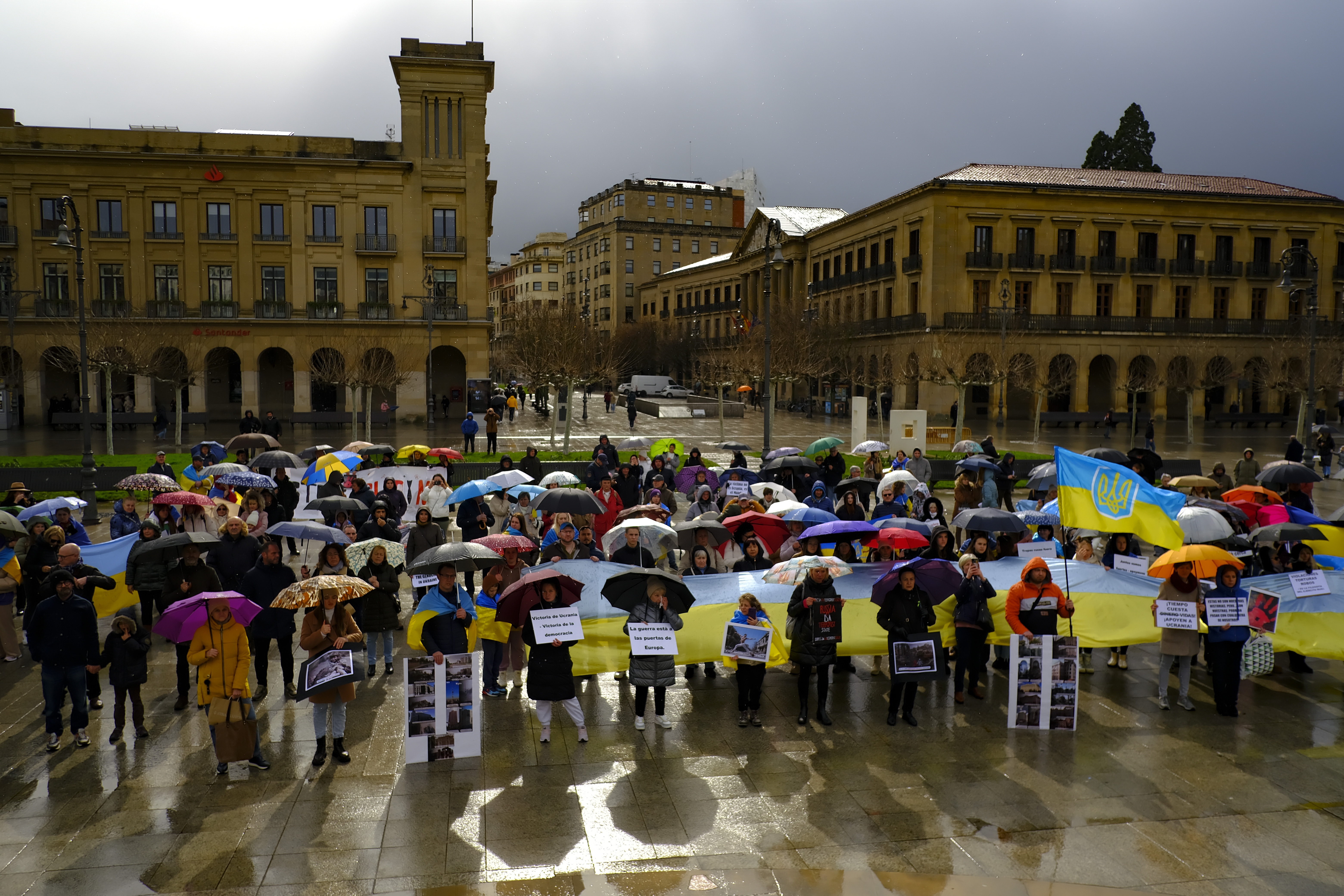 Ukrainian supporters gather as they take part in a demonstration at Plaza del Castillo square during 2th anniversary of Russia's invasion of Ukraine, in Pamplona, northern Spain, Saturday, Feb. 24