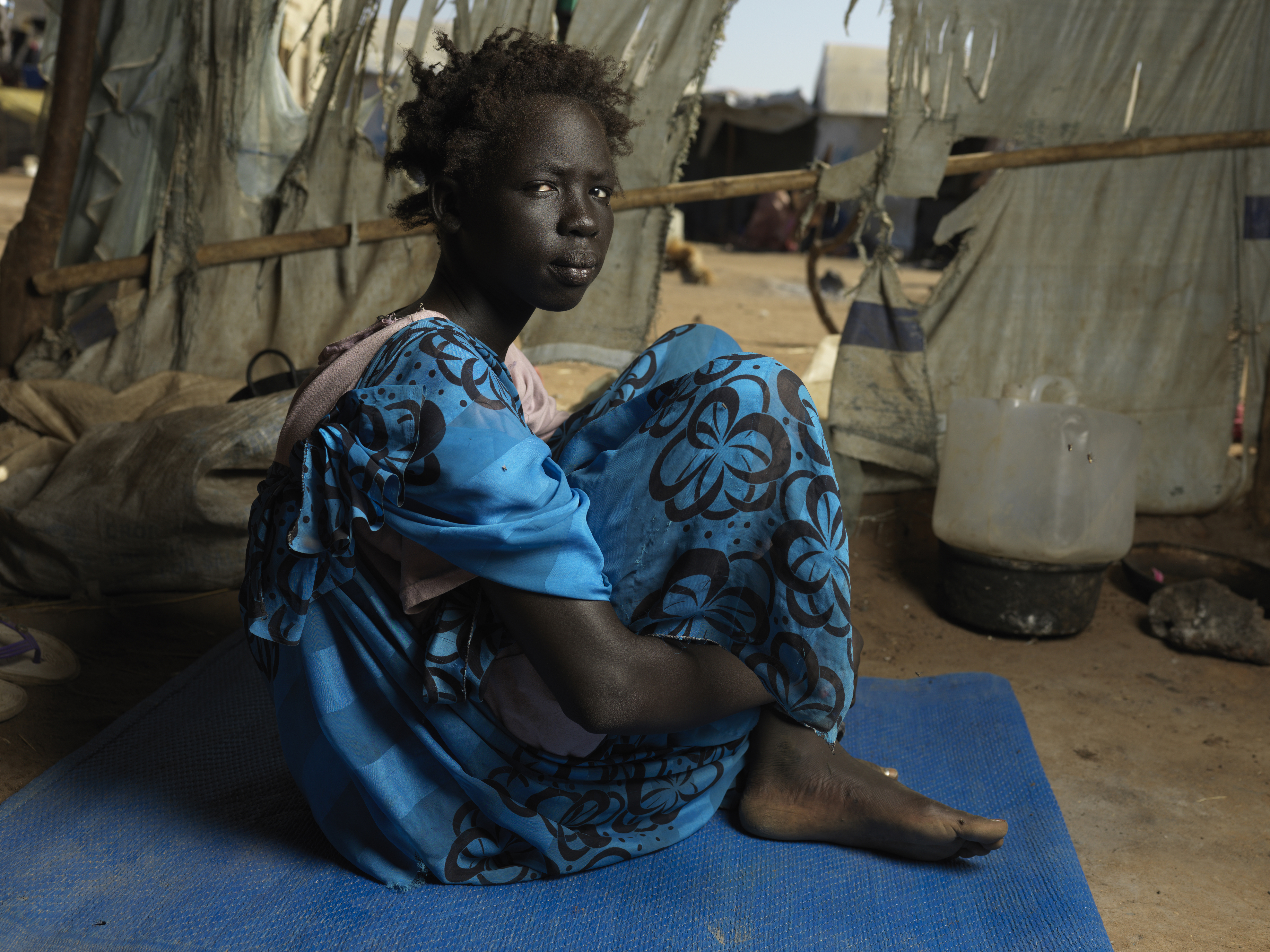 Portrait of Nyasebit 13, who lost her Mother in the Sudan war.