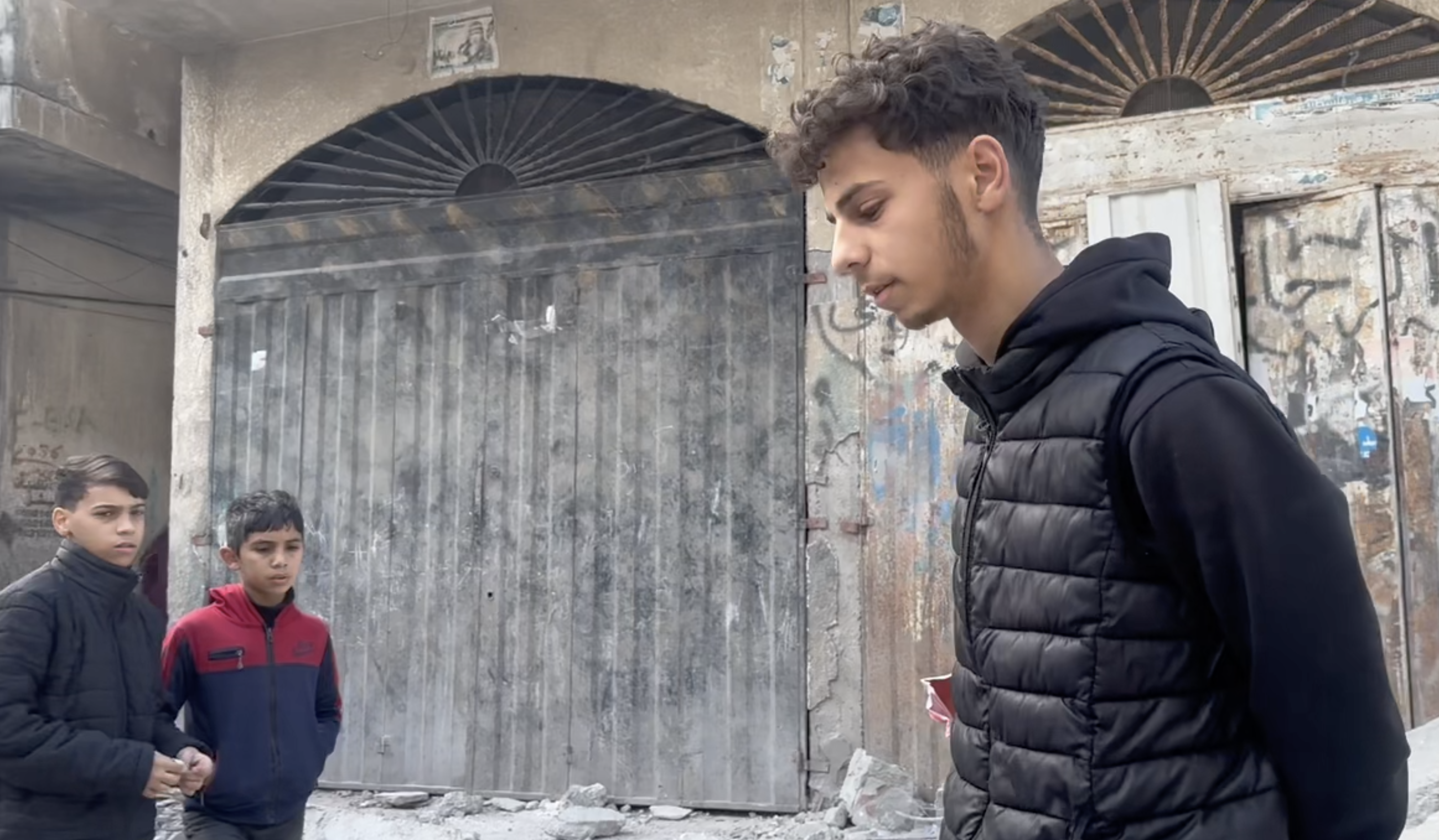 Shehab walking around, looking downcast