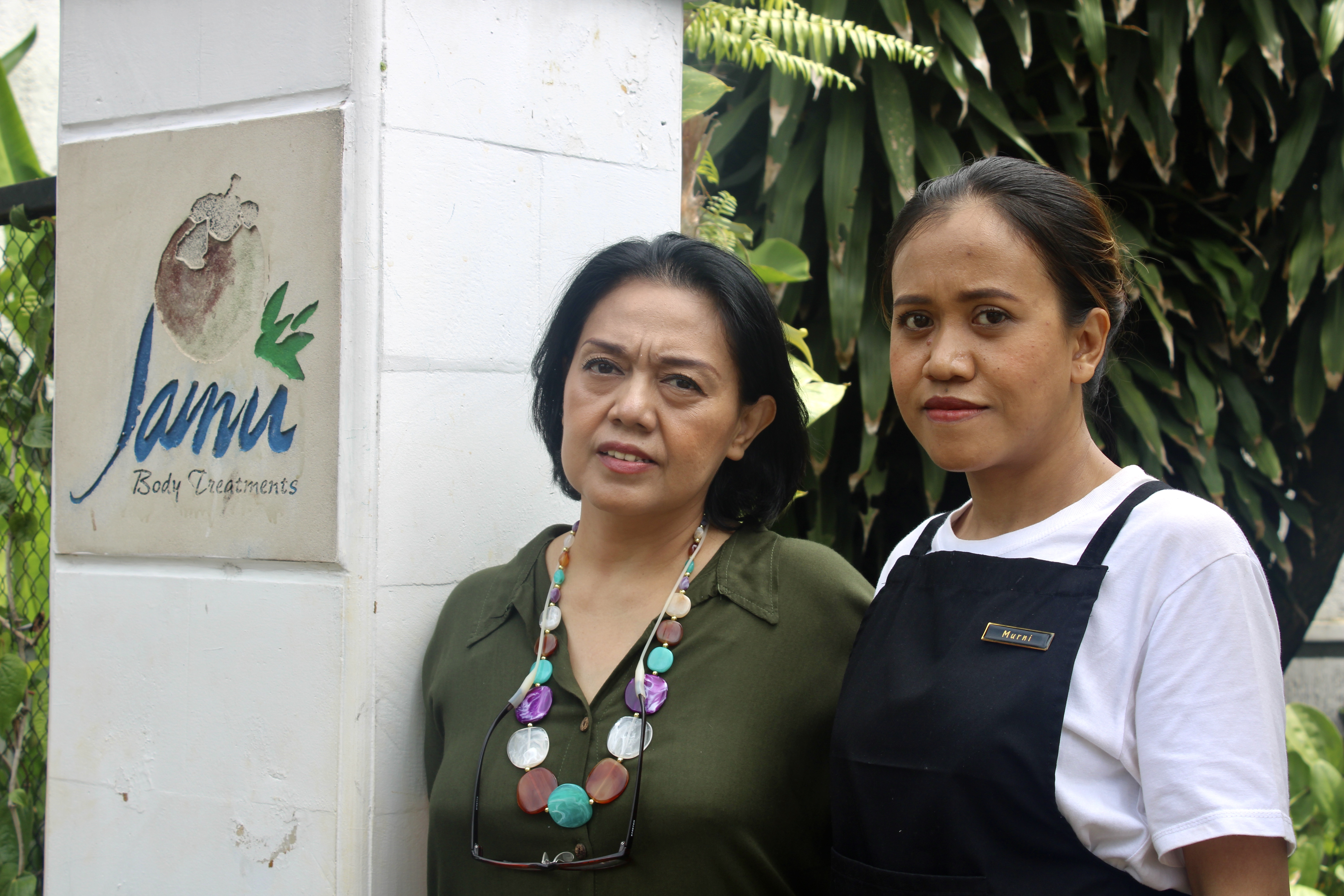 Sofie Sulaiman and Murniyati. They are standing at the entrance to the spa