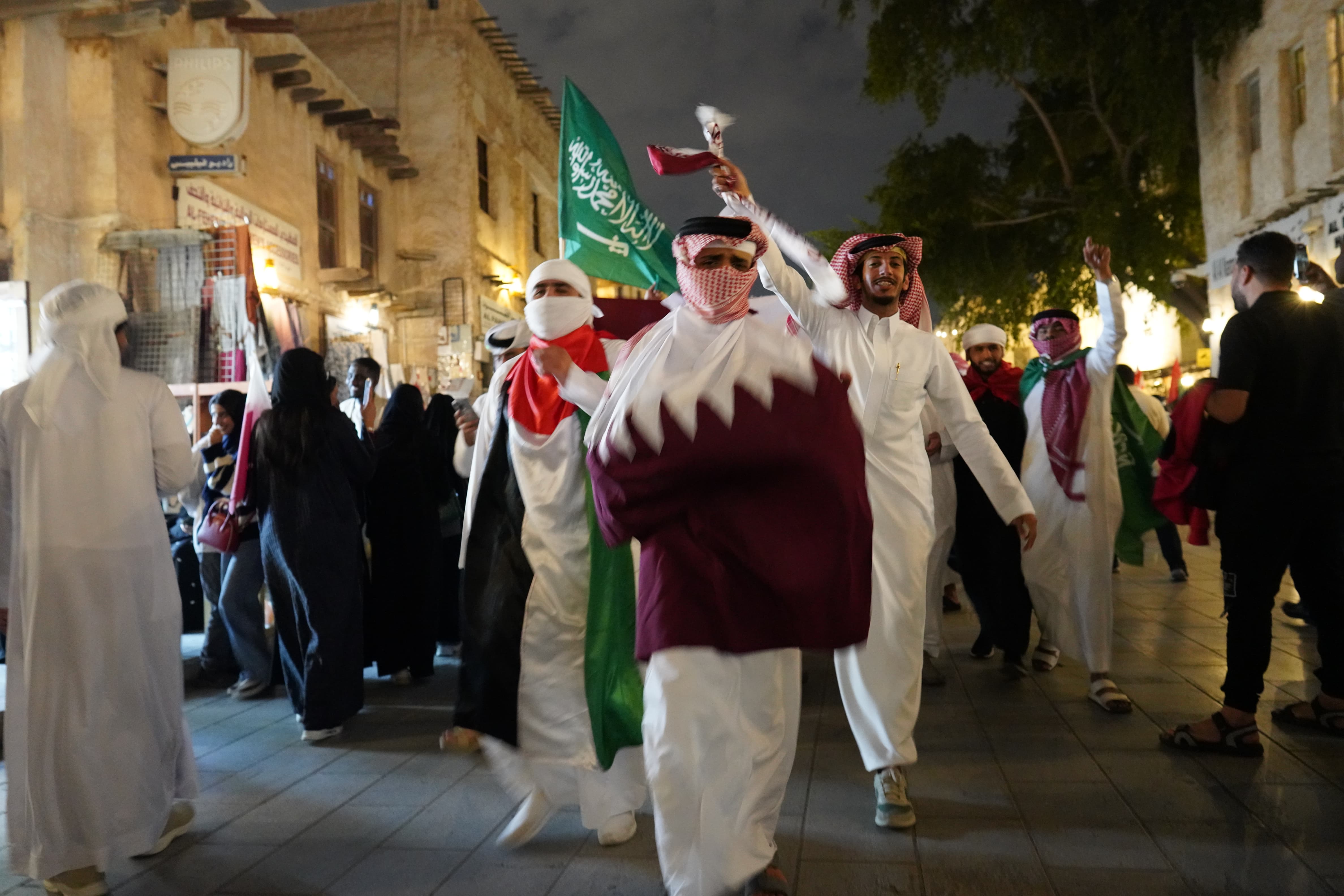Qatar fans celebrate their team winning the AFC Asian Cup in Doha's Souq Waqif [Sorin Furcoi/Al Jazeera]