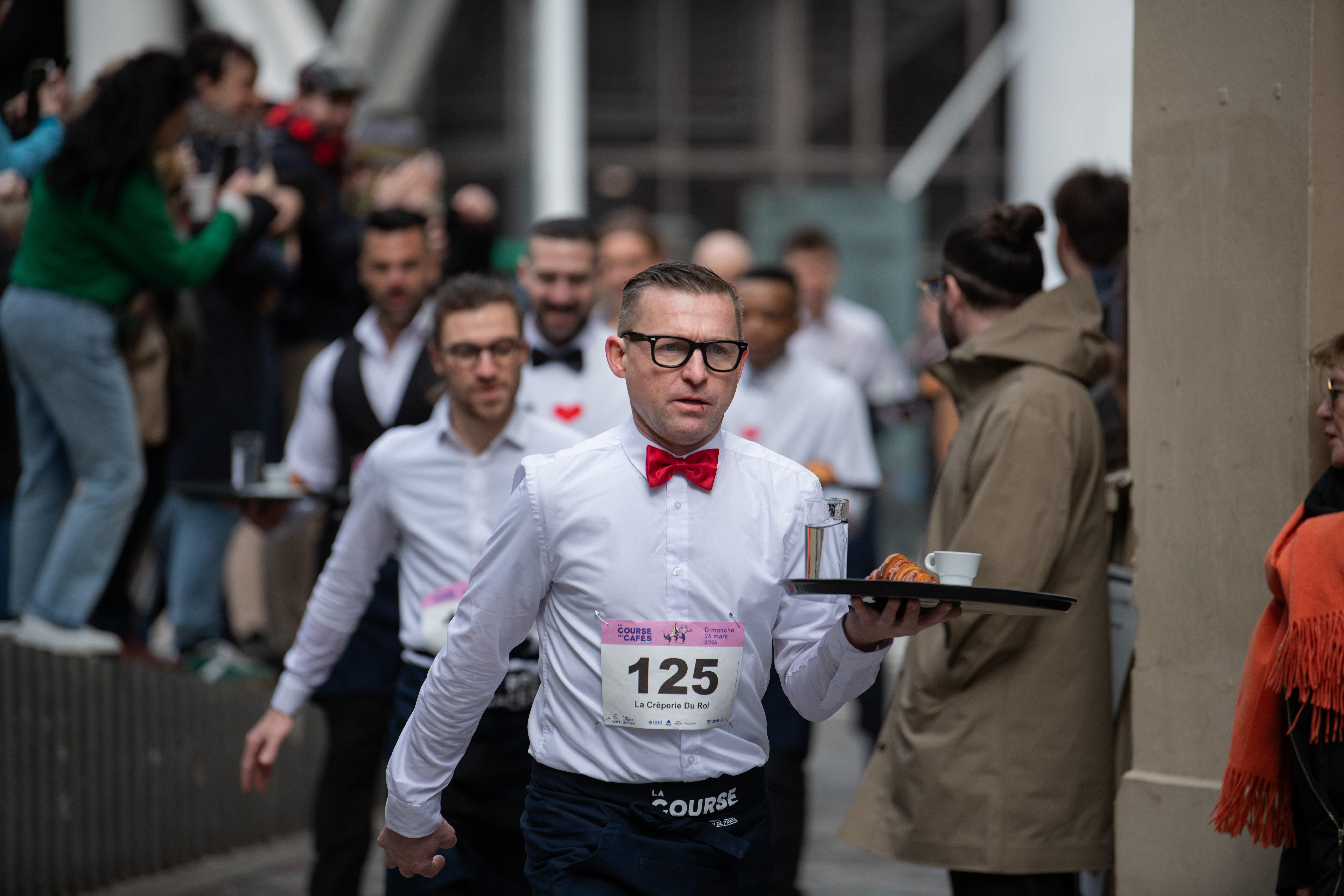 Racers were required to sport the white top and black bottoms traditionally worn by Parisian waiters.