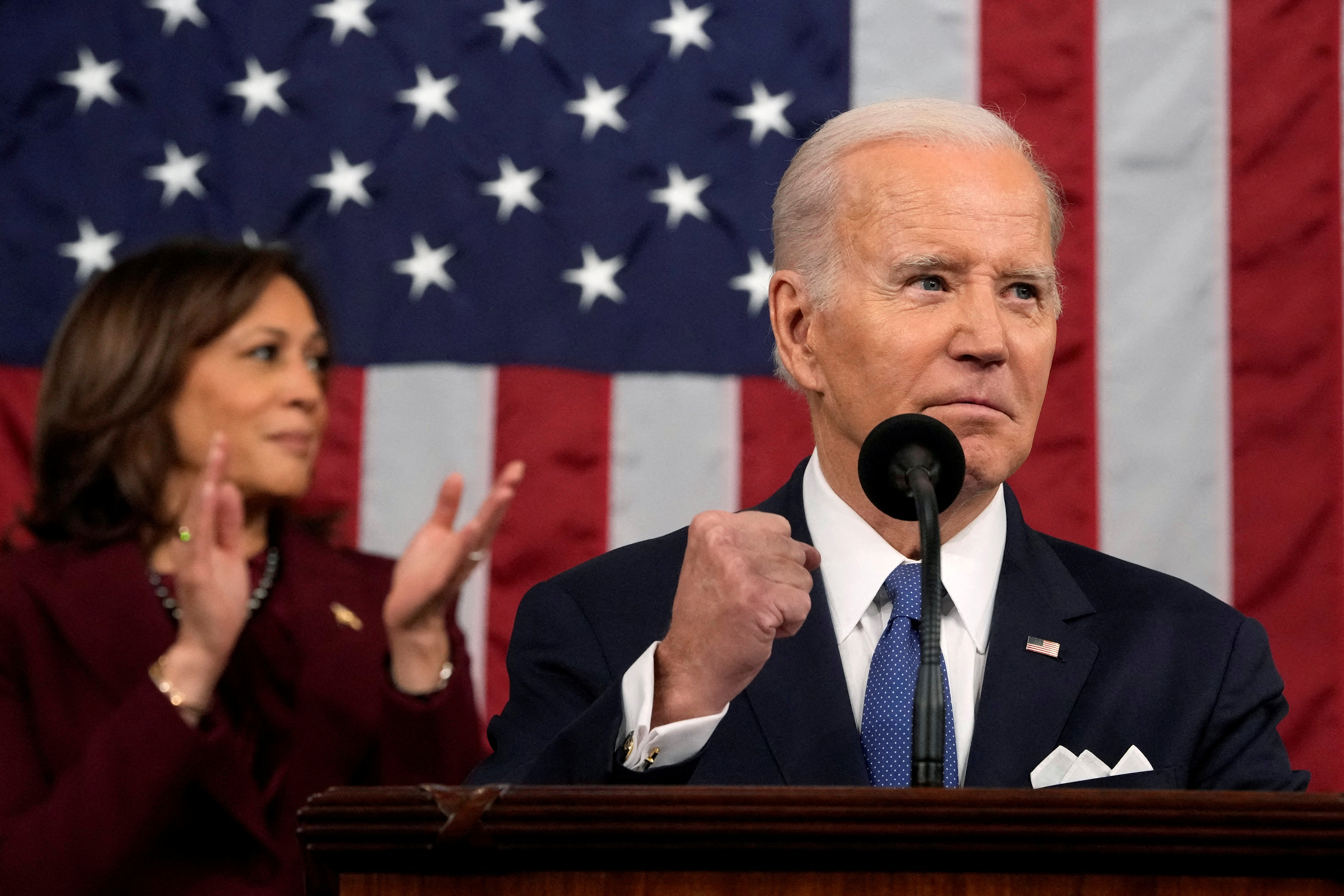 US President Joe Biden delivers the 2023 State of the Union address as VP Kamala Harris claps behind him