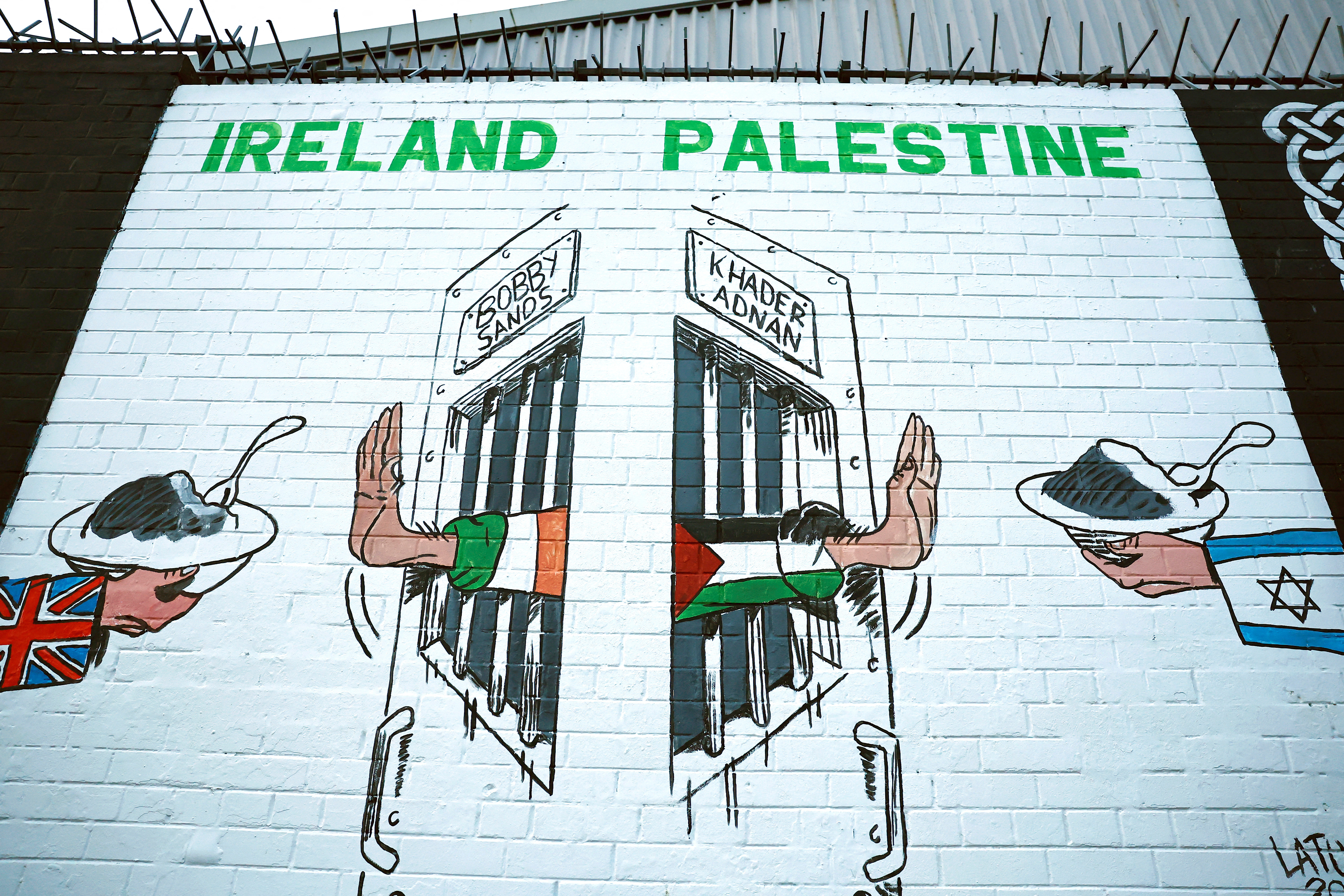 A view of a mural in solidarity with Palestinians in Gaza, amid the ongoing conflict between Israel and Hamas, in the Nationalist area along the International Wall on the Falls Road in Belfast, Northern Ireland