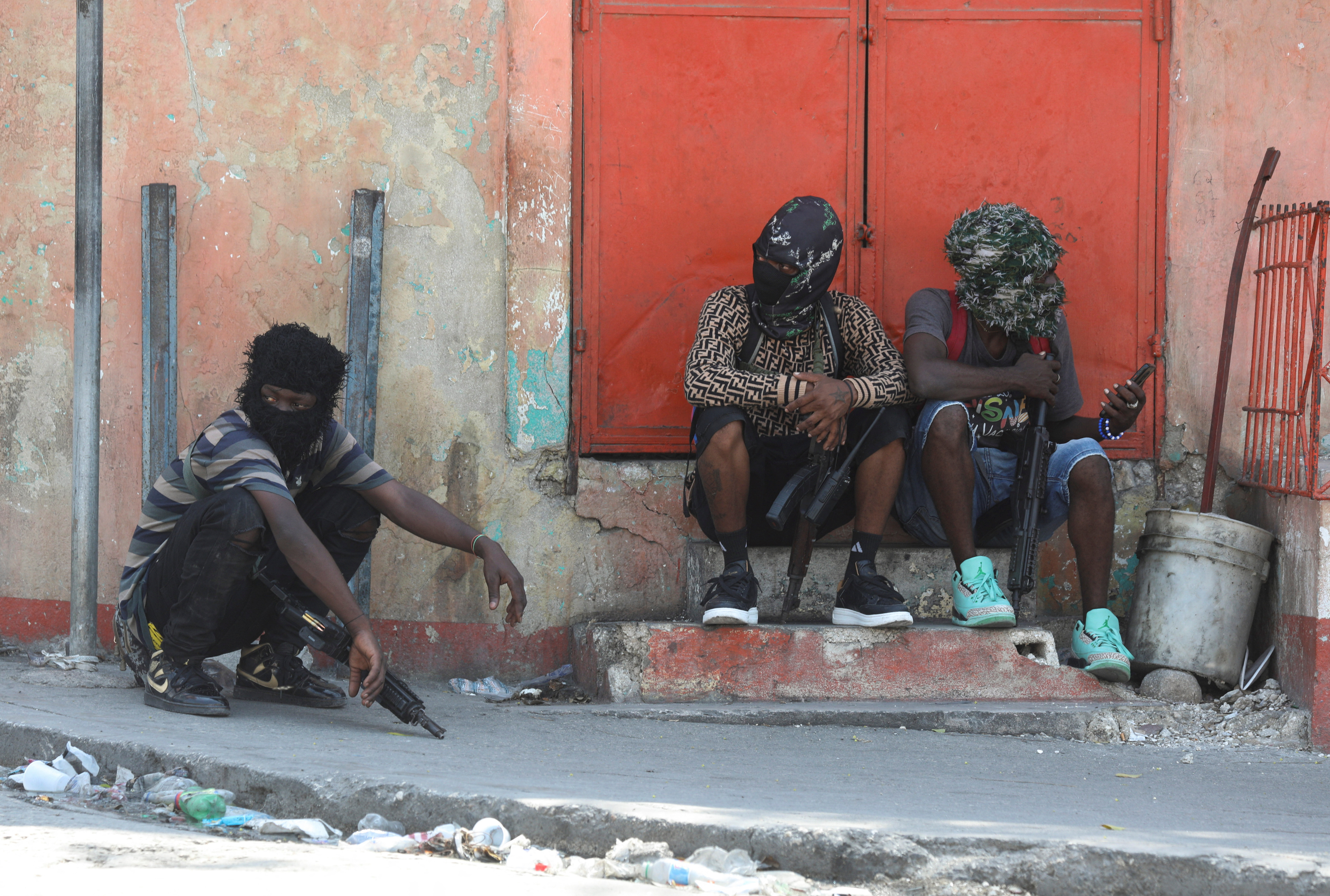 Gang members sit together in Port-au-Prince, Haiti
