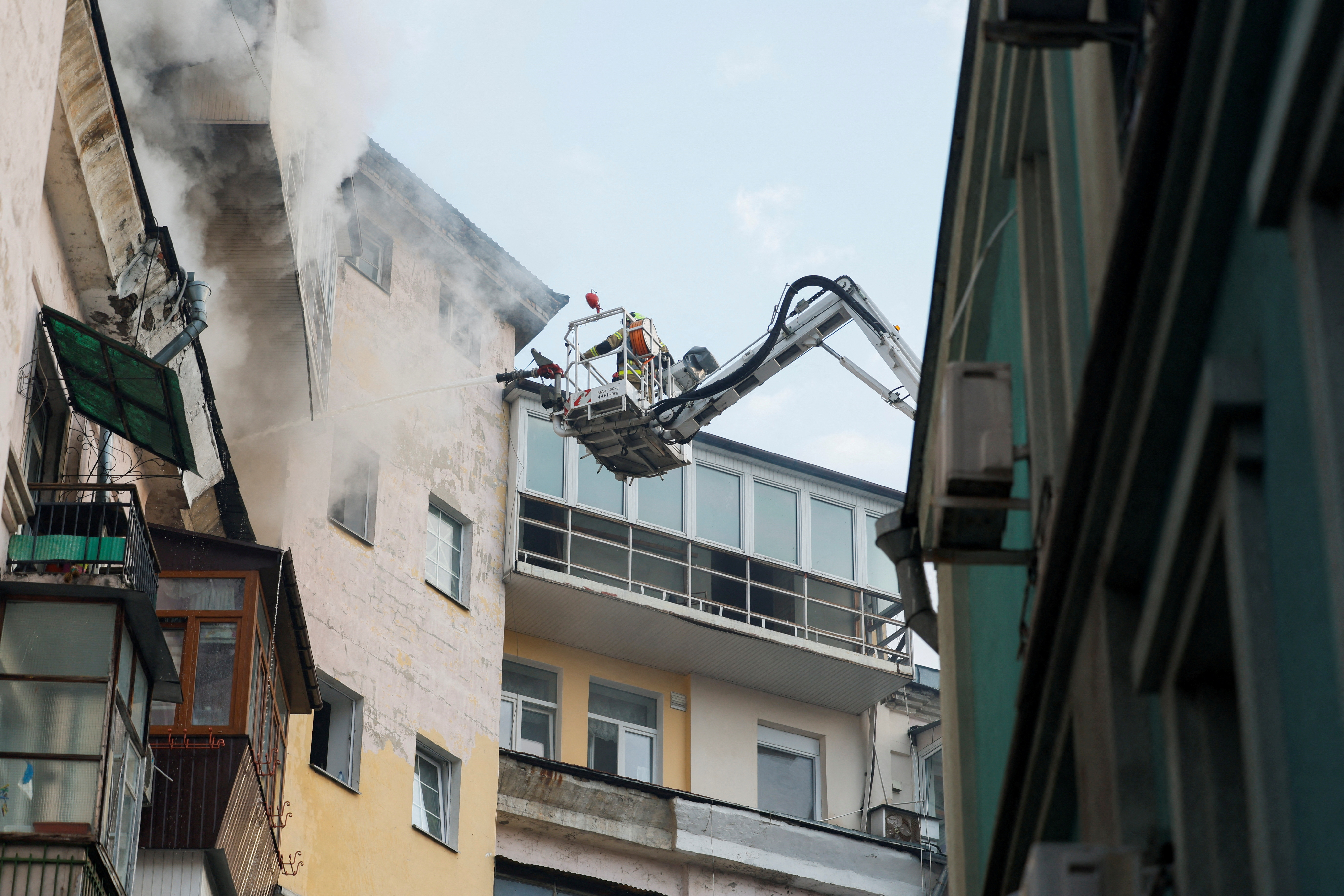 A rescuer works at a site of a buildin