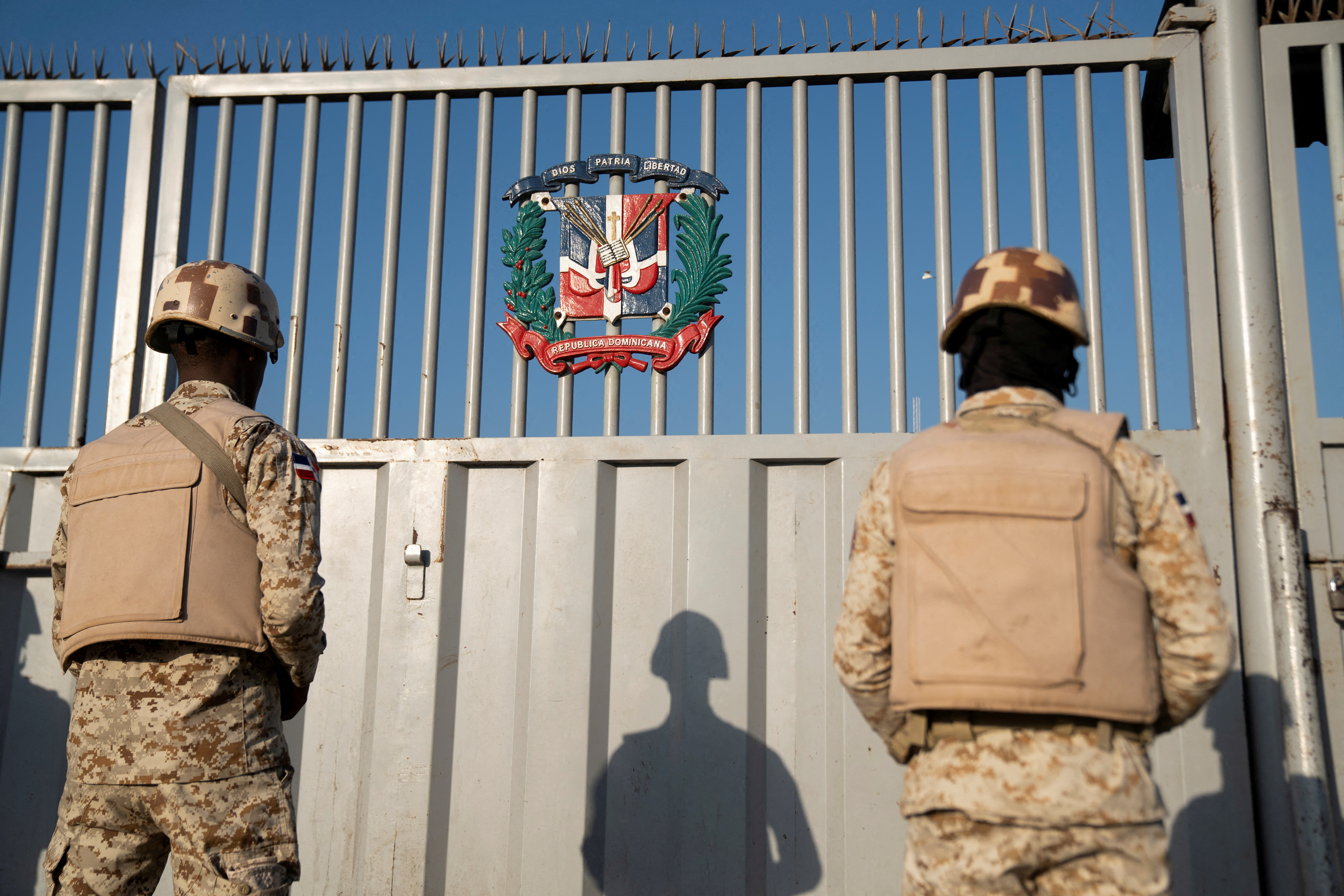 Dominican soldiers keep watch at the border with Haiti