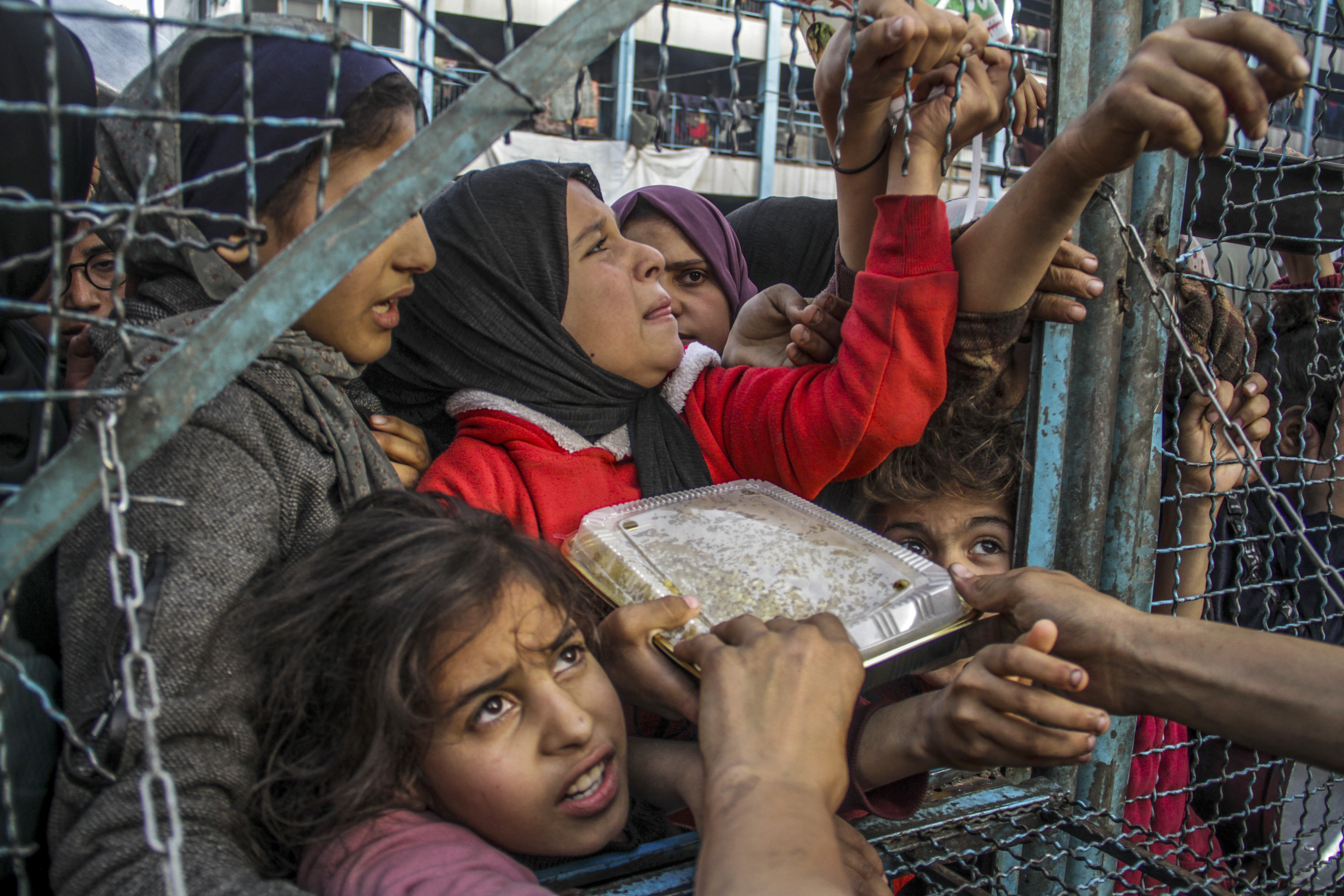 A crowd of starving Palestinians, wait to receive food in Jabalia refugee camp, Gaza on March 27, 2024. [Mahmoud Issa/Anadolu]