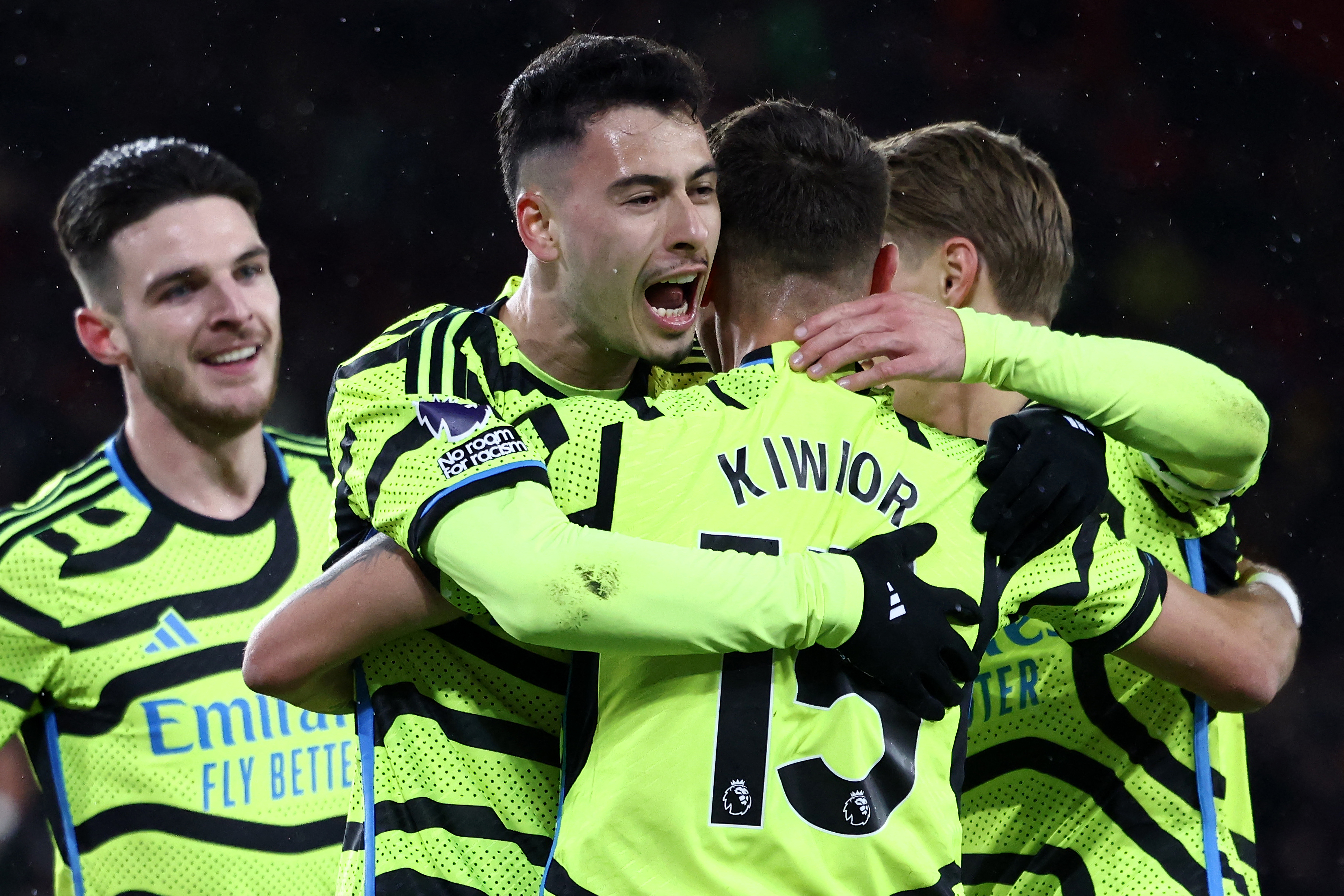 Arsenal's Brazilian midfielder #11 Gabriel Martinelli (2L) is mobbed by teammates after scoring the team's third goal