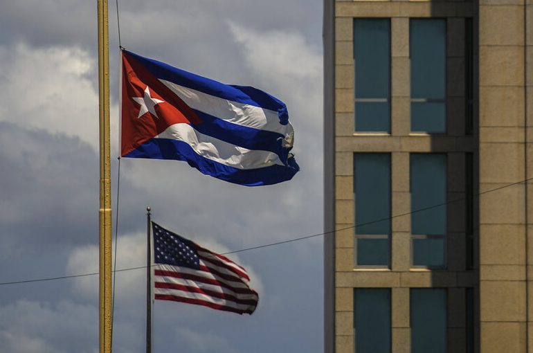 US and Cuban flags