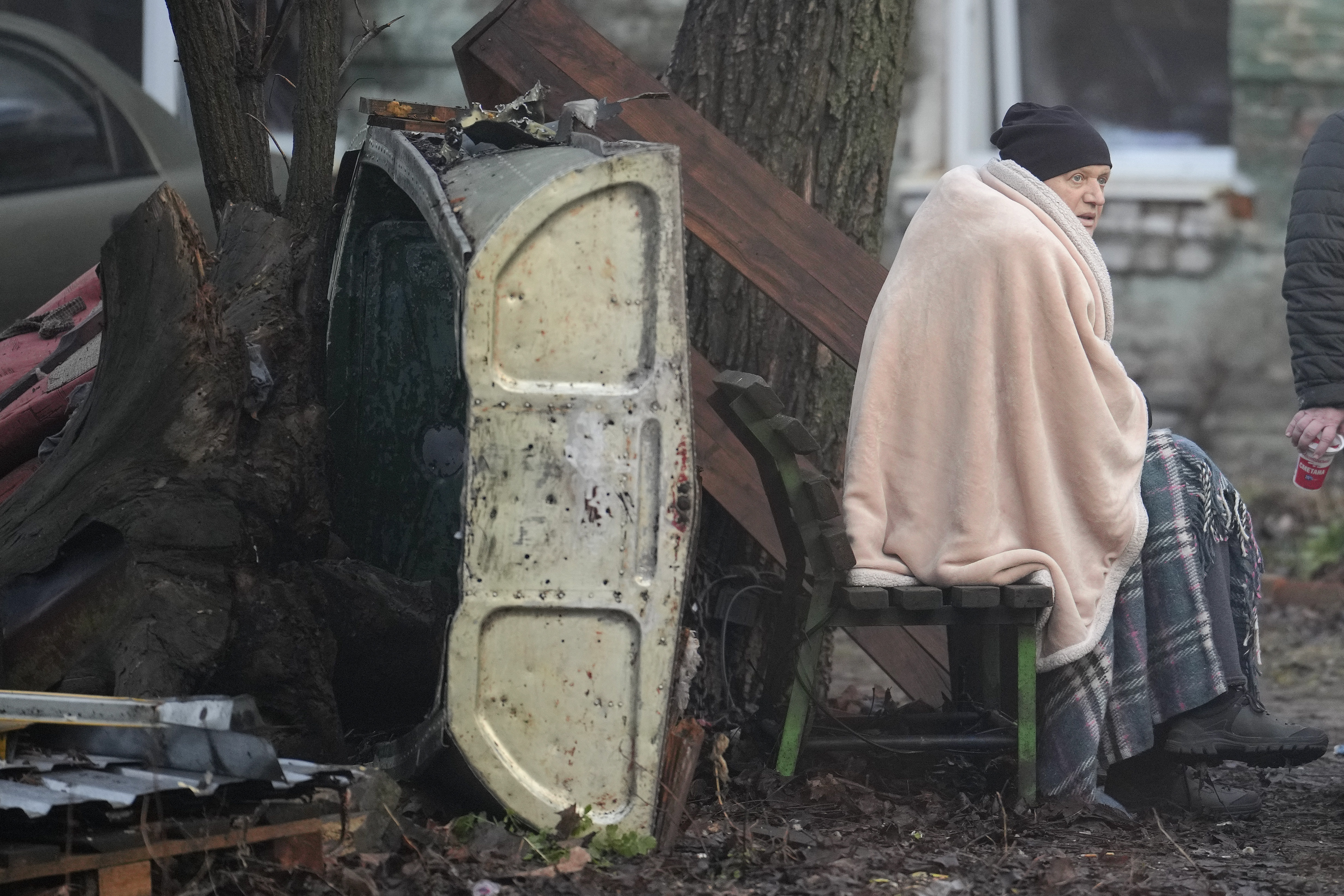 Residents gather outside of an apartment block after Russian attacks in Kyiv,