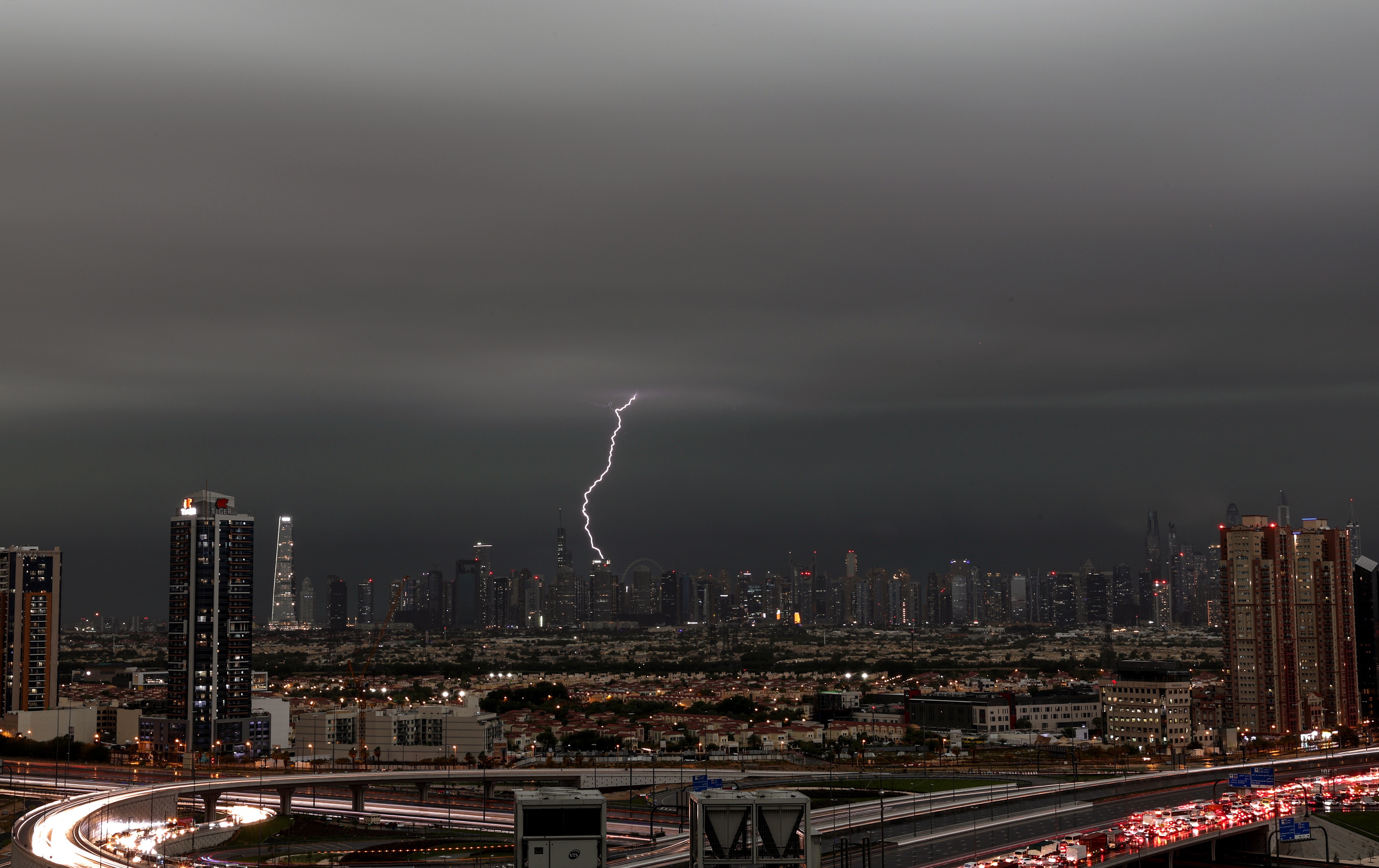 A lightning flashes through the sky during a heavy rainfall in Dubai, United Arab Emirates, 16 April 2024. A severe wave of thunderstorms with heavy rainfall is hitting most UAE's cities especially in Dubai, Sharjah and Al Ain where the Asian Champions League semi final first leg match between UAE's Al-Ain Club and Al-Hilal from Saudi Arabia has been postponed. 