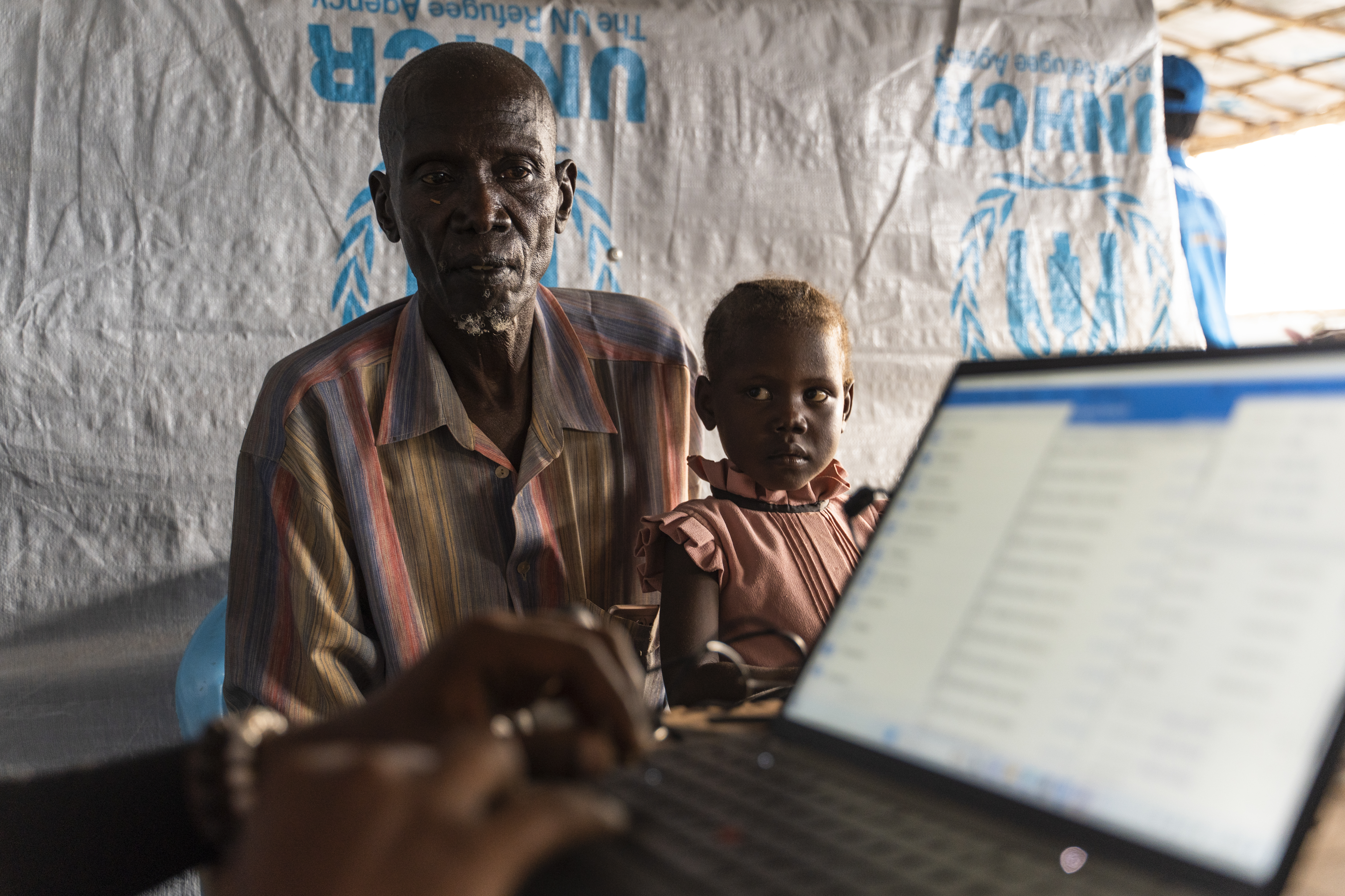 In November 2023, Alfadi Faiz and his niece at the UNHCR registration point in Renk, South Sudan