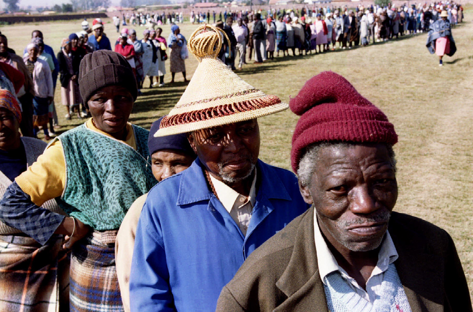 Residents of Katlehong, a township east of Johannesburg queue up to vote April 26, 1994. Blacks flocked to polling stations across South Africa to vote for the first time as polling began for the sick, the old and disabled in the country's historic all-race elections. SCANNED FROM NEGATIVE REUTERS/Juda Ngwenya AVD/CMC