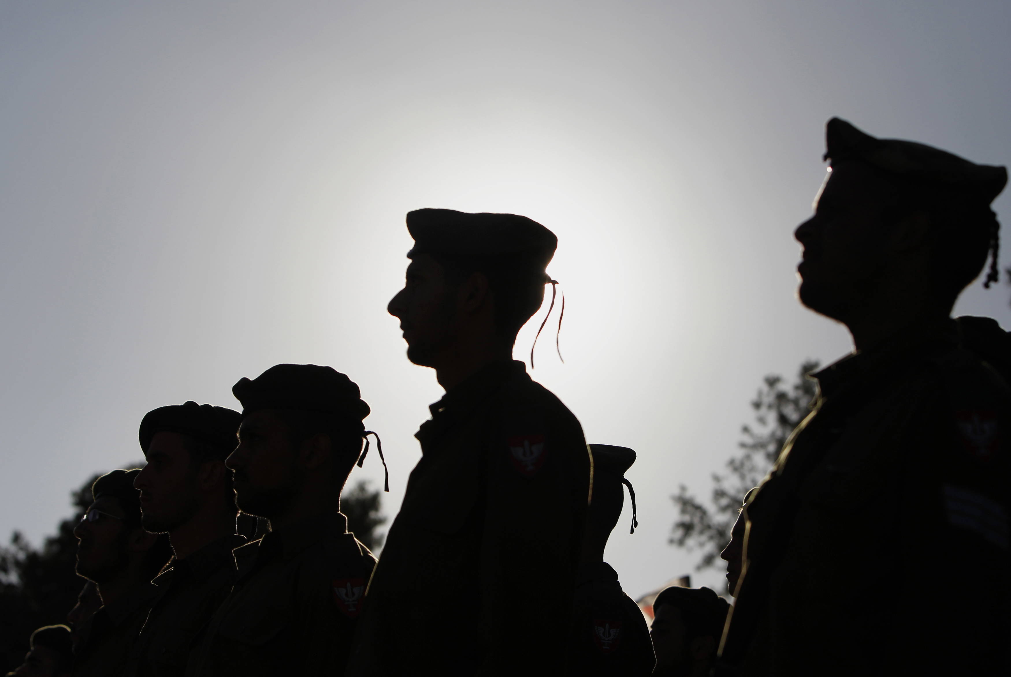 Israeli soldiers of the Netzah Yehuda Haredi infantry battalion stand at attention during their swearing-in ceremony in Jerusalem May 26, 2013.