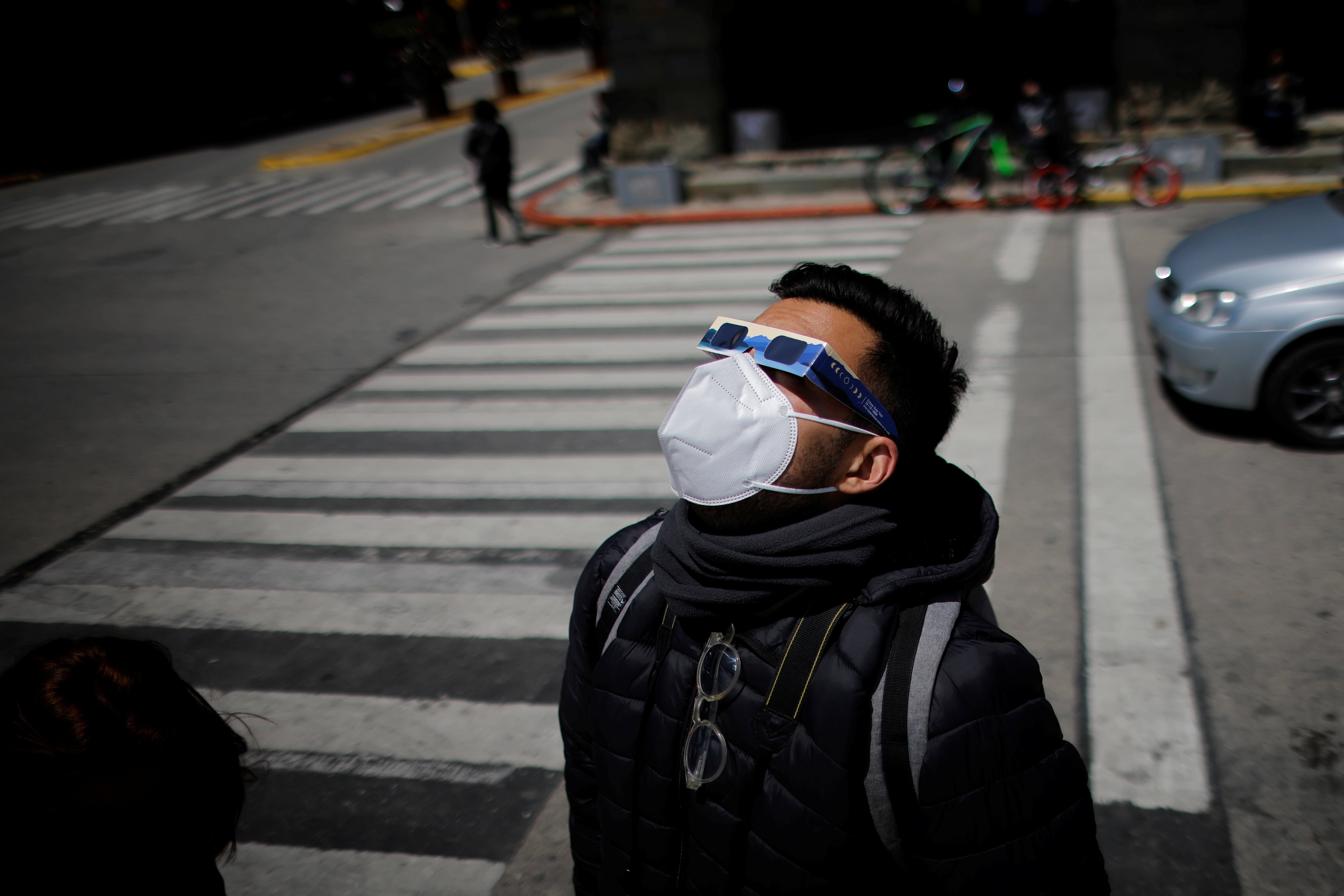 A man looks up to observe a solar eclipse in Argentina