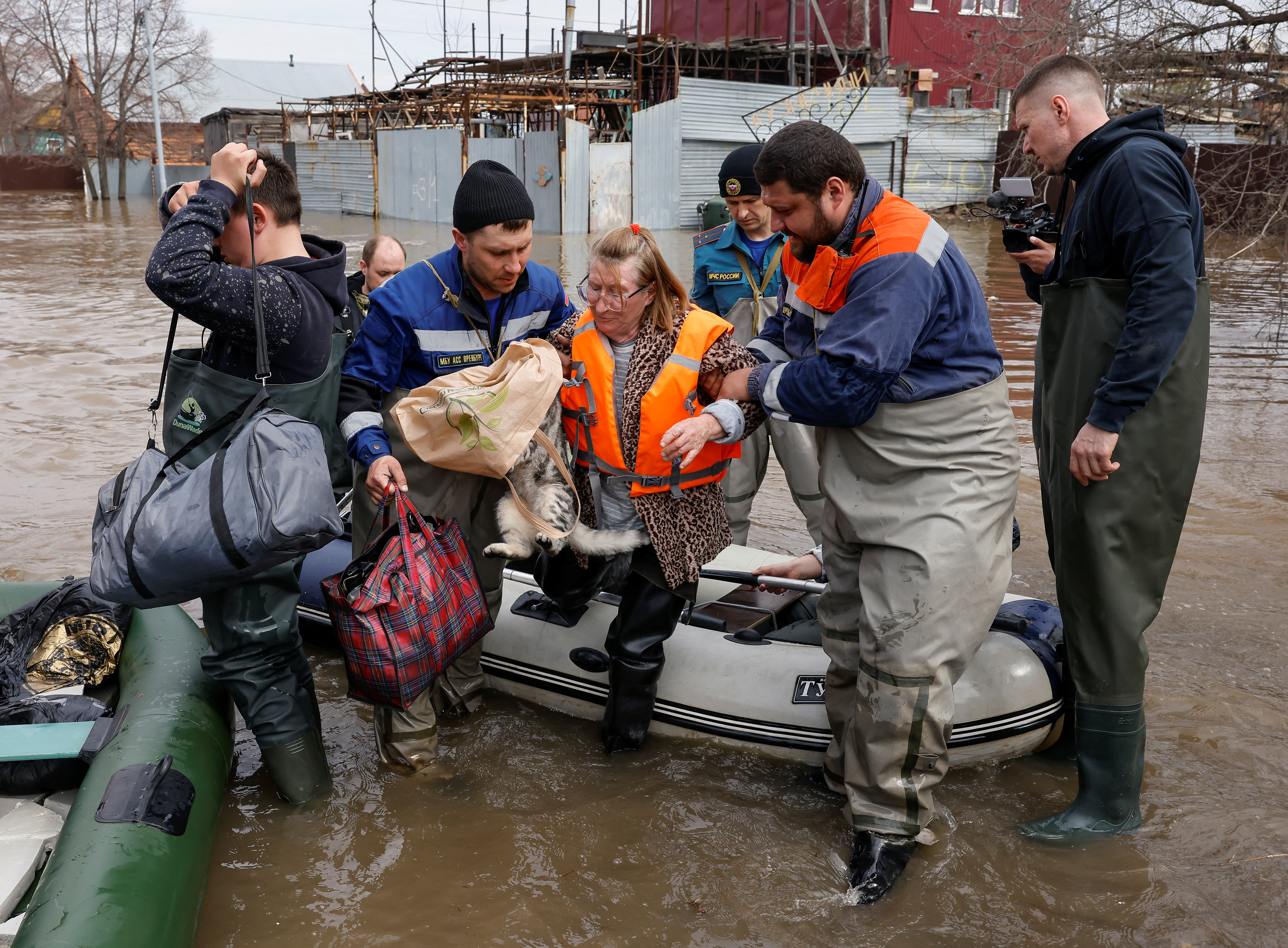 Local resident Taisia is evacuated amid flooding in the city of Orenburg, Russia April 10, 2024. REUTERS/Maxim Shemetov