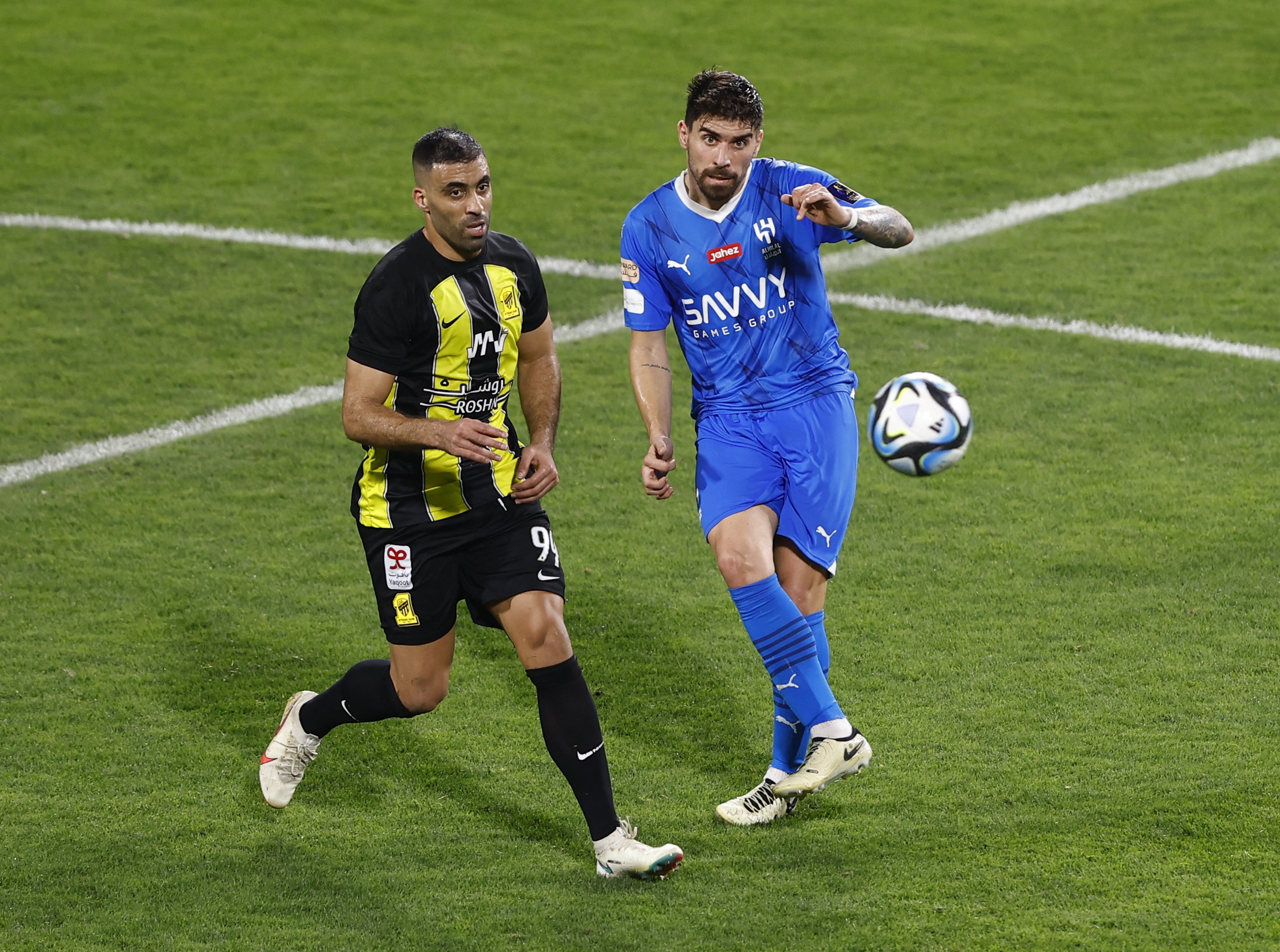Abderrazak Hamdallah (left) and Ruben Neves content the ball.