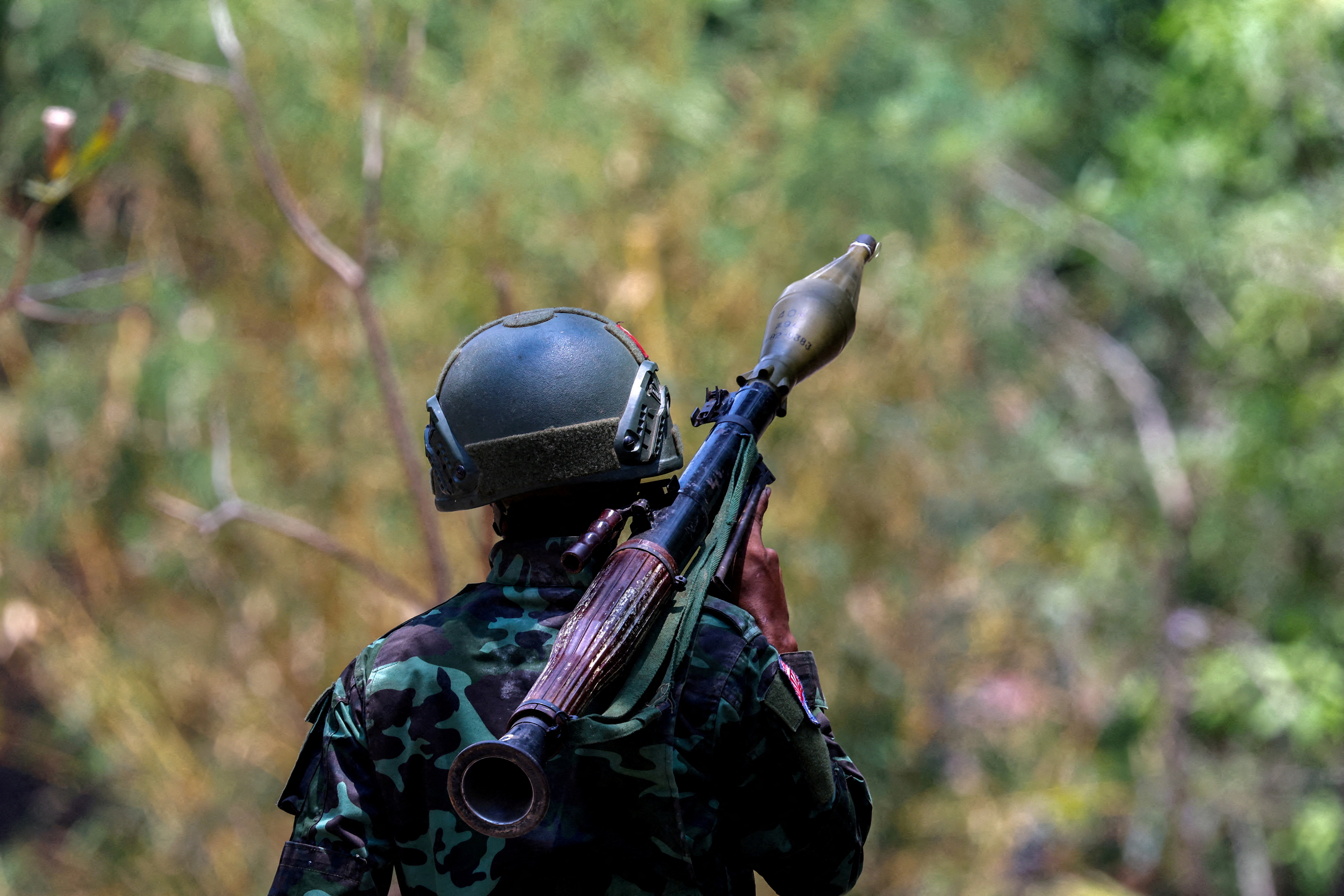 A KNLA soldier carrying an RPG in a seized military base just outside Myawaddy